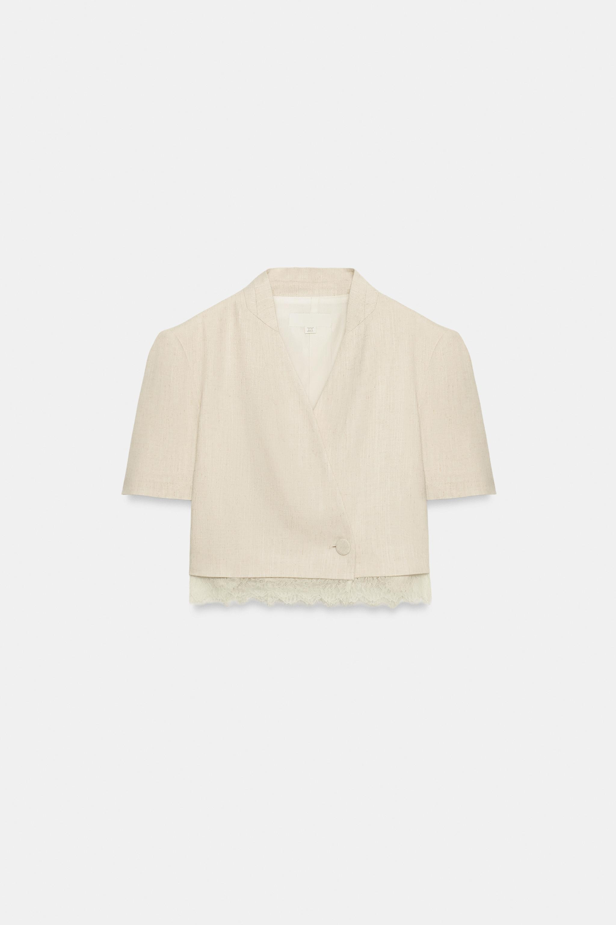 Blazer with a collarless neckline and short sleeves with shoulder pads. Featuring a hem finished ... | Zara UK