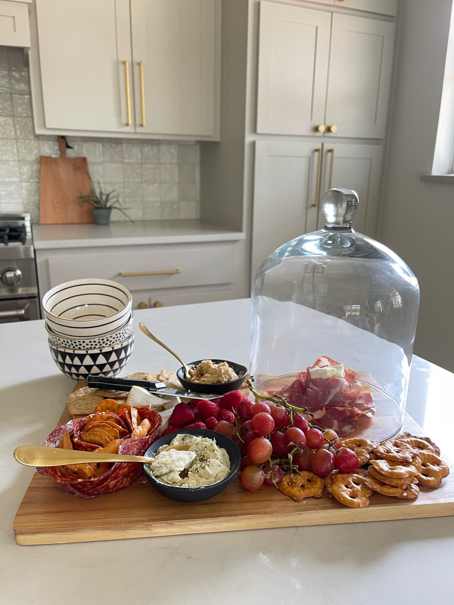 My charcuterie board set (includes the board, cloche (glass cover), 2 black bowls, and cheese knife has been restocked! I bought mine 3 years ago and also use it for decor  

#LTKfamily #LTKfindsunder50 #LTKhome