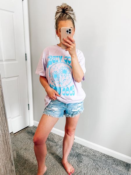 Code: BLONDEBELLE to save 💜 Graphic tee is oversized and I’m wearing small. Denim shorts fit tts and I’m wearing a size small! 
.
.
.
Denim shorts, graphic tee, oversized graphic tee, summer outfit, causal summer outfit, mom style, spring outfit, summer style, pink lily 

#LTKunder100 #LTKstyletip #LTKunder50