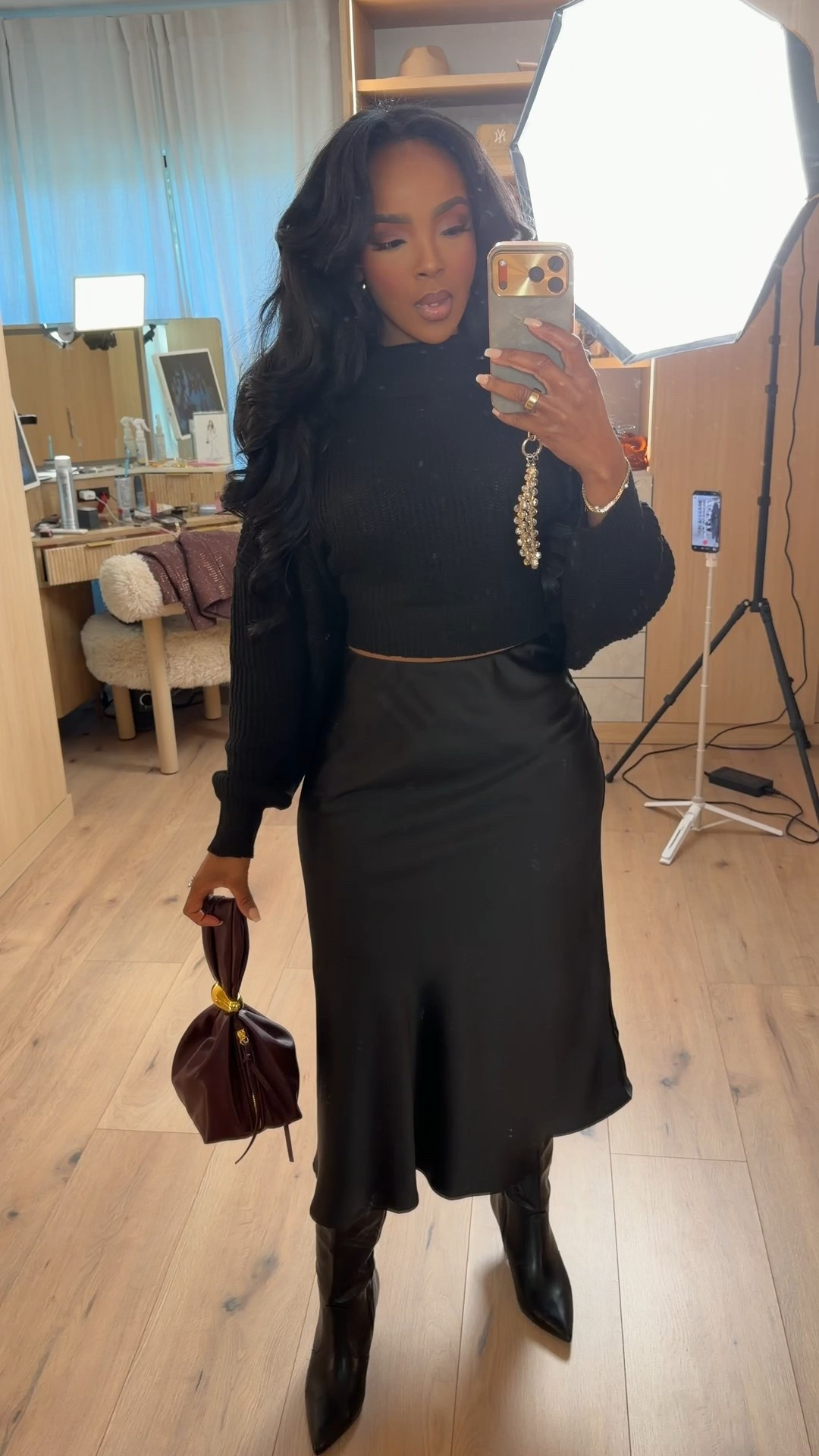 Effortlessly elevated with a soft edge ✨  
This monochrome black look is the definition of chic minimalism — cozy texture on top paired with a sleek satin skirt for contrast. An easy outfit that feels polished without trying too hard, and one you’ll reach for again and again because the cost per wear just keeps dropping.

Perfect for date night, dinner plans, or a stylish everyday moment when you want to feel put together but comfortable.

📏 Sizing & Fit  
Top: Size Small  
Skirt: Size Small  
Height: 5'4"  
Weight: 138 lbs  
Bust: 34D | Waist: 27" | Hips: 40"

Soft knit top, satin midi skirt, black outfit styling, chic everyday look, elevated basics, capsule wardrobe staples, versatile neutral outfit, fall winter outfit ideas, long-term shopping strategy.

Save this post to revisit later 🤍  
Follow me on Instagram and YouTube @kirasfashionfinds