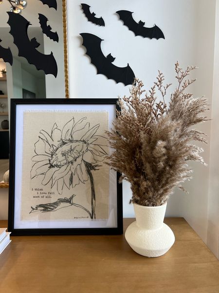 Fall decor, console table, fall stems, vase, mirror, bats
- -
The sunflower picture is sold out - I linked similar.

#LTKSeasonal #LTKHoliday #LTKhome