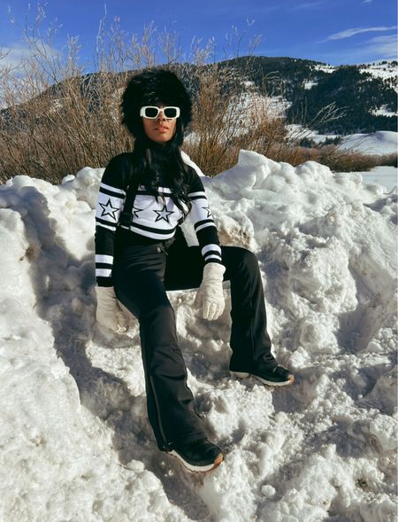 Black ski overalls, star ski turtleneck sweater, snow boots, faux fur hat and white sunglasses 

#LTKFind #LTKtravel #LTKshoecrush