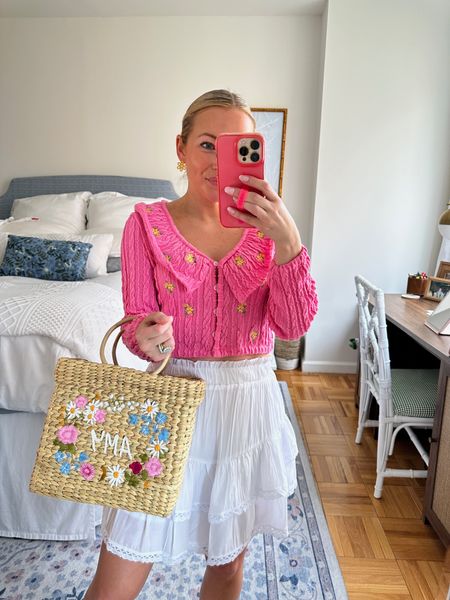 Perfect spring outfit! White ruffle skirt, pink embellished, button down sweater, and customized straw bag. 

#LTKitbag #LTKSeasonal #LTKfit