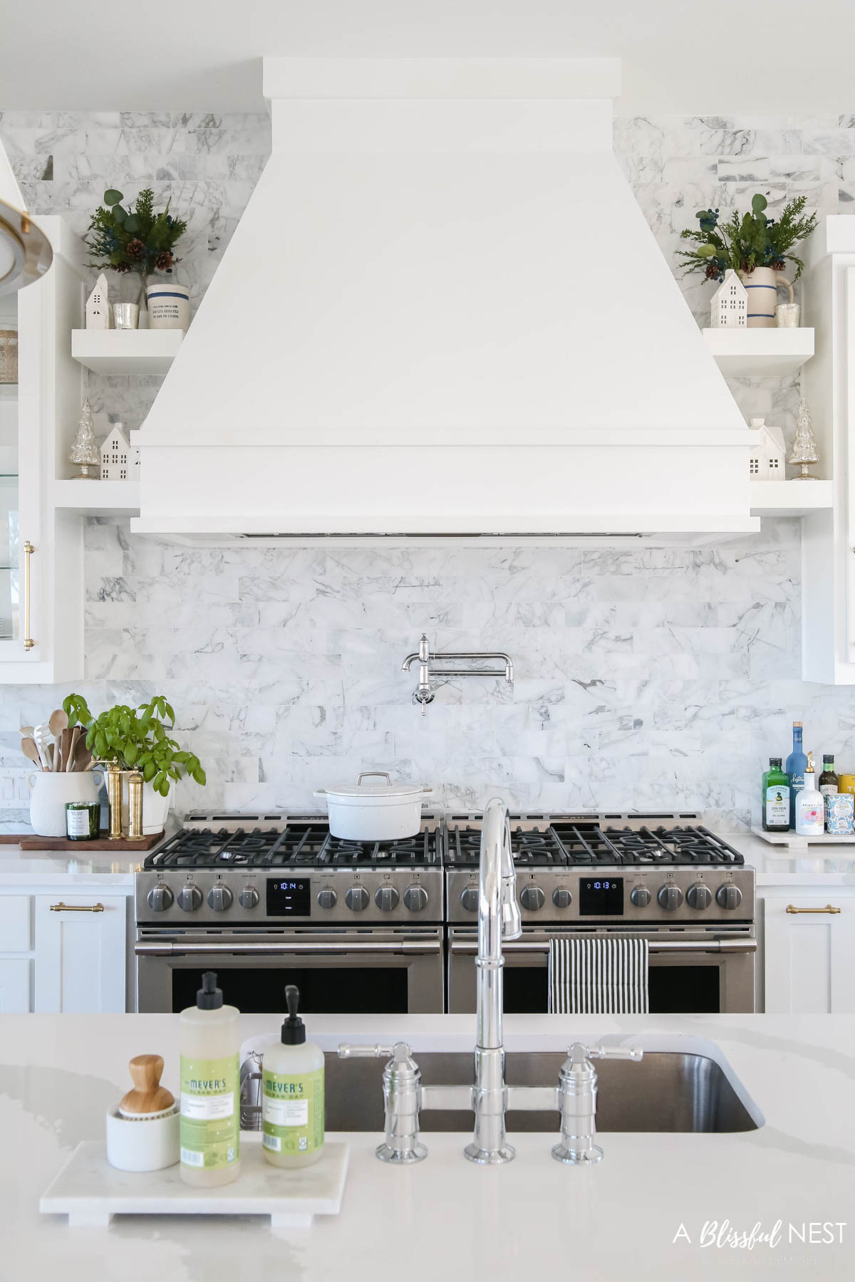 I loved how this space came to life with just a few touches of green. Shop everything here.
European mill, Mud Pie utensil holder, wooden spoons, blueberry greenery pick, Christmas village houses, bamboo dish scrub brushes, Mrs. Meyer's kitchen set, holiday scented candle 

 #LTKHoliday #LTKSeasonal #LTKHome