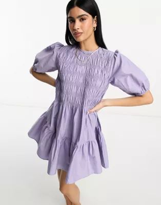 ASOS DESIGN cotton shirred mini smock dress with puff sleeve in lilac | ASOS (Global)