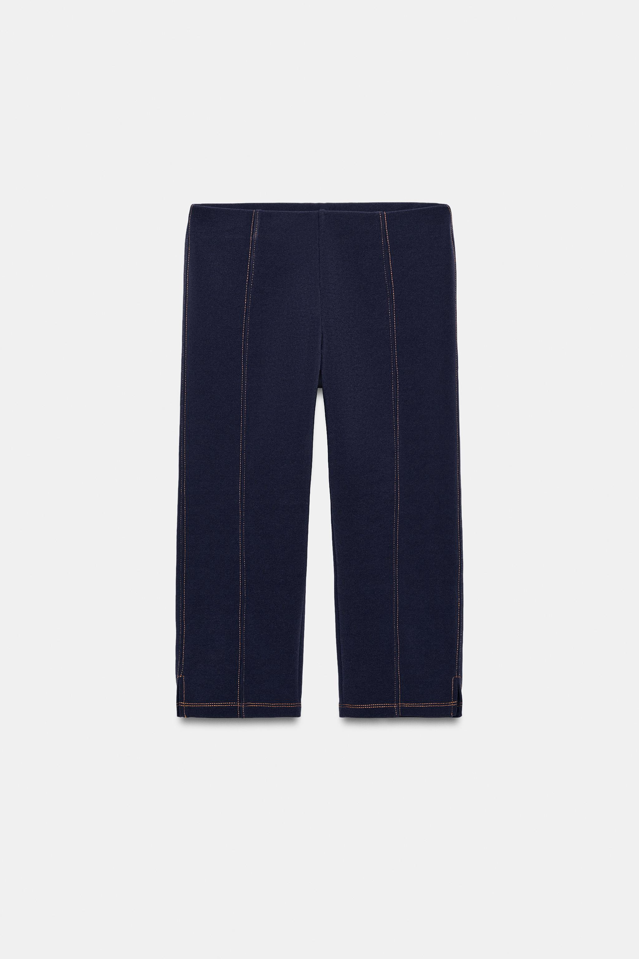 Mid-rise pants with an elastic waistband. Featuring contrasting stitching details. | Zara US