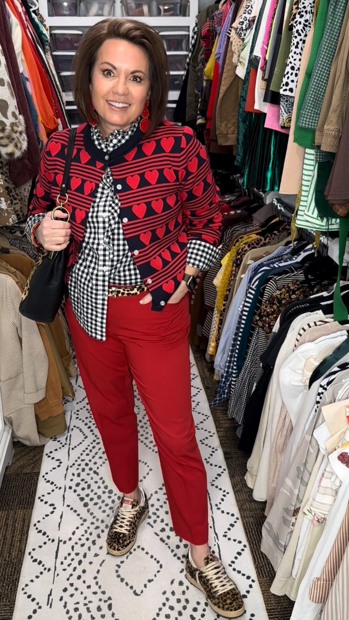 Proof that classic pieces don’t have to feel boring.

This outfit is all about smart pattern mixing and intentional color. The heart-print cardigan adds personality, layered over a black-and-white gingham button-down for a polished but playful look. Red ankle pants keep the outfit crisp and tailored, while leopard sneakers bring in a fun, unexpected twist. Finished with a black shoulder bag and statement earrings, this is an easy outfit for work, lunch dates, or everyday errands when you want to look put together without overthinking it.

Shop the look here 👇
heart print cardigan, gingham button-down shirt, red ankle pants, leopard sneakers, black shoulder bag, statement earrings, everyday polished outfit

⸻

heart cardigan outfit, heart print sweater women, novelty cardigan women, patterned cardigan outfit, gingham button down women, black and white gingham shirt outfit, red ankle pants women, red pants outfit women, tailored ankle pants women, leopard sneakers women, leopard print shoes outfit, pattern mixing outfit women, casual chic outfit women, polished casual outfit, work to weekend outfit women, women over 40 fashion, women over 50 style, midlife fashion inspiration, comfortable everyday outfit women, statement cardigan outfit, playful classic style, chic mom outfit, closet staples women, elevated casual style


#LTKootd #LTKFindsUnder50 #LTKOver40