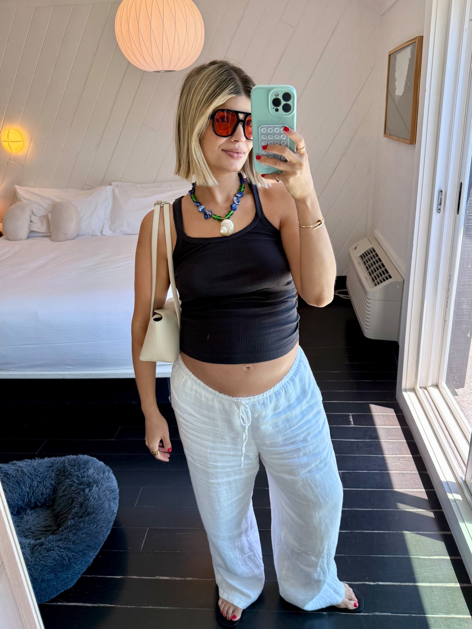 Upstate Fit: 
- Aire Sunnies 
- Seashell necklace is from the Sunday market in Bali (my only purchase from the trip, handmade by a local designer). I linked similar styles! 
- Redone tank, my favorite tank, a year round staple for all seasons. I’m wearing size small (non cropped version) 
- J.Crew linen pants, wearing size Medium 
- Jeffrey Campbell Jelly flip flops, wearing size 41. I would go up two sizes, they run very small. 
- Freja handbag, the quality is amazing, I love the shape and it fits a ton of stuff. The color is the perfect neutral and the size is ideal for day or night. 

#LTKSwim #LTKBump #LTKStyleTip