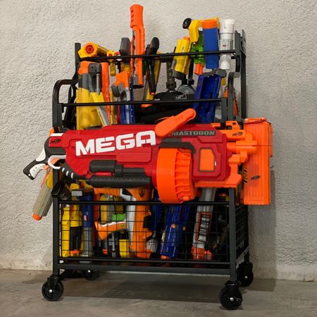 A station for all the nerf-gun lovers! These kids have a large collection of all sizes, so keeping them contained was a challenge. This cart keeps them sorted by size, easy to find, and even easier for kids to put away. Bonus- the wheels allow it to be easily brought outside!

#LTKfamily #LTKhome #LTKkids