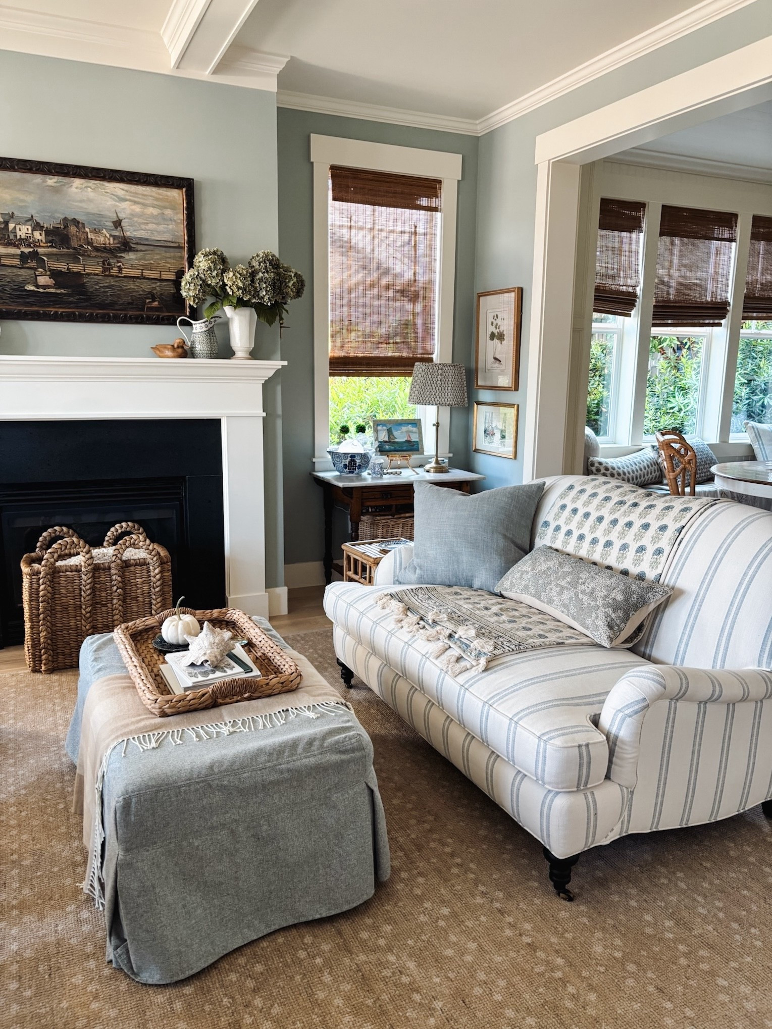 Living room sources:

Slipcovered Ottoman in Chambray, Performance Heathered Basketweave
Seagrass Tray on Ottoman
Faux Dusty Green Hydrangeas
Ceramic Vases
Striped Loveseat in Mist, Performance Double Stripe
Tassel Throw Blanket on Sofa
Blue + White Patterned Pillow on Loveseat
Belgian Linen Pillow in Mineral Blue on Loveseat
Wingback Chairs in Blue, Vintage Blythe Print
Ottomans in Blue, Classic Stripe
Scalloped Wood Frame
Ivory Knit Pillow
Ivory Stitched Throw Blanket
Plaid Herringbone Throw Blanket in Dune
Coral Lidded Box
Brass Floor Lamp
Gold Wall Candle Holder
Flameless Spiral Taper Candle in Chambray
Green Linen Pillows in Sage Grass
Chambray Bowl
Preserved Boxwood Plants (small size and mini set)
Handwoven Baskets
Seagrass Picture Frame
Neutral Patterned Rug
Mango Wood Beaded Garland
Embroidered Floral Pillow on Bench
Bamboo shades
Duck 

neutral home decor, timeless style, cozy living, layered textures, natural light, inviting spaces, seasonal home decor, cozy accents, cottage charm, vintage-inspired decor, intentional home style, collected and cozy, timeless interiors, relaxed elegance

#LTKFindsUnder50 #LTKSaleAlert #LTKHome