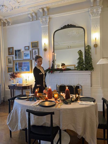 Thanksgiving table and holiday sweater dress on sale. Beige linen tablecloth, marble pedestal table, black, dining chair, pinecone candle.

#LTKsalealert #LTKCyberweek #LTKHoliday