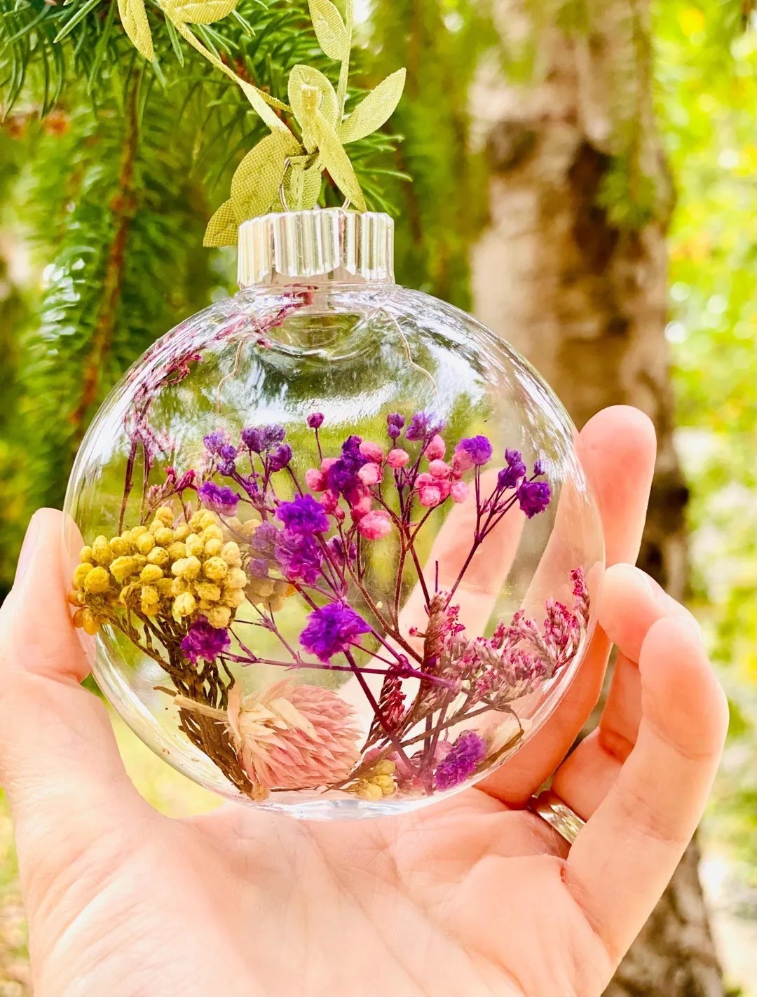 Bring a touch of whimsy to your holiday decorating with this enchanting dried-flower ornament by TheWoodsyWildflower. Each clear ornament is filled with dreamy blooms in soft pink and purple tones, creating a miniature botanical world that feels both magical and elegant. Perfect for gifting, party favors, or adding charm to wrapped presents, these lightweight pieces are easy to hang and effortlessly elevate any festive display. #EtsyFinds #HolidayDecor #DriedFlowers #BotanicalOrnament #GiftIdeas #LTKHoliday #WhimsicalDecor

#LTKHome #LTKGiftGuide #LTKHoliday