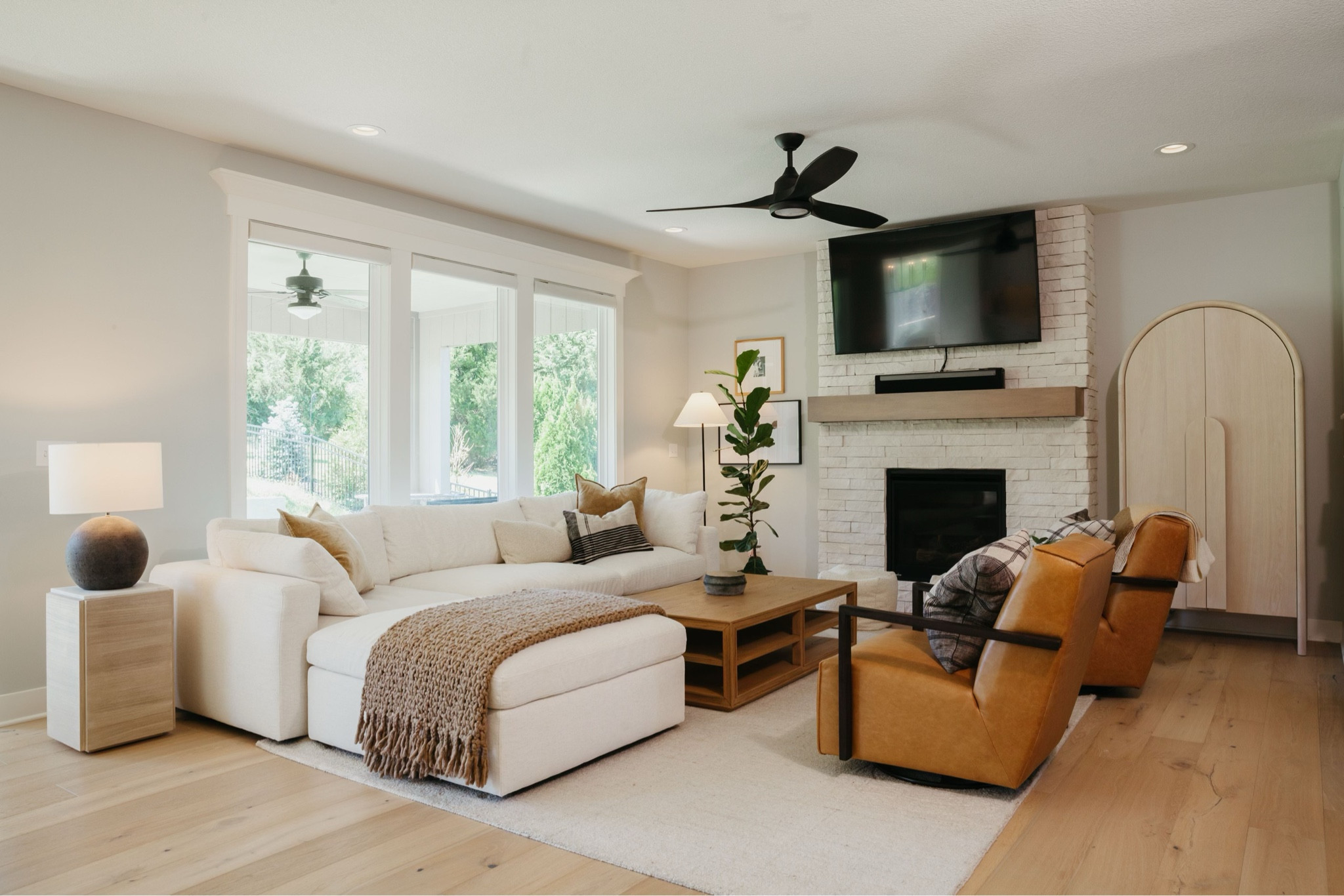 Airy living room design for a calm cool collected, modern, livable luxury feel with a white sofa, leather side, chairs, Empire, shade floor lamp, large, easy, plant tree, and lots of texture. Living room refresh & virtual design 

#LTKHome #LTKSummerSales