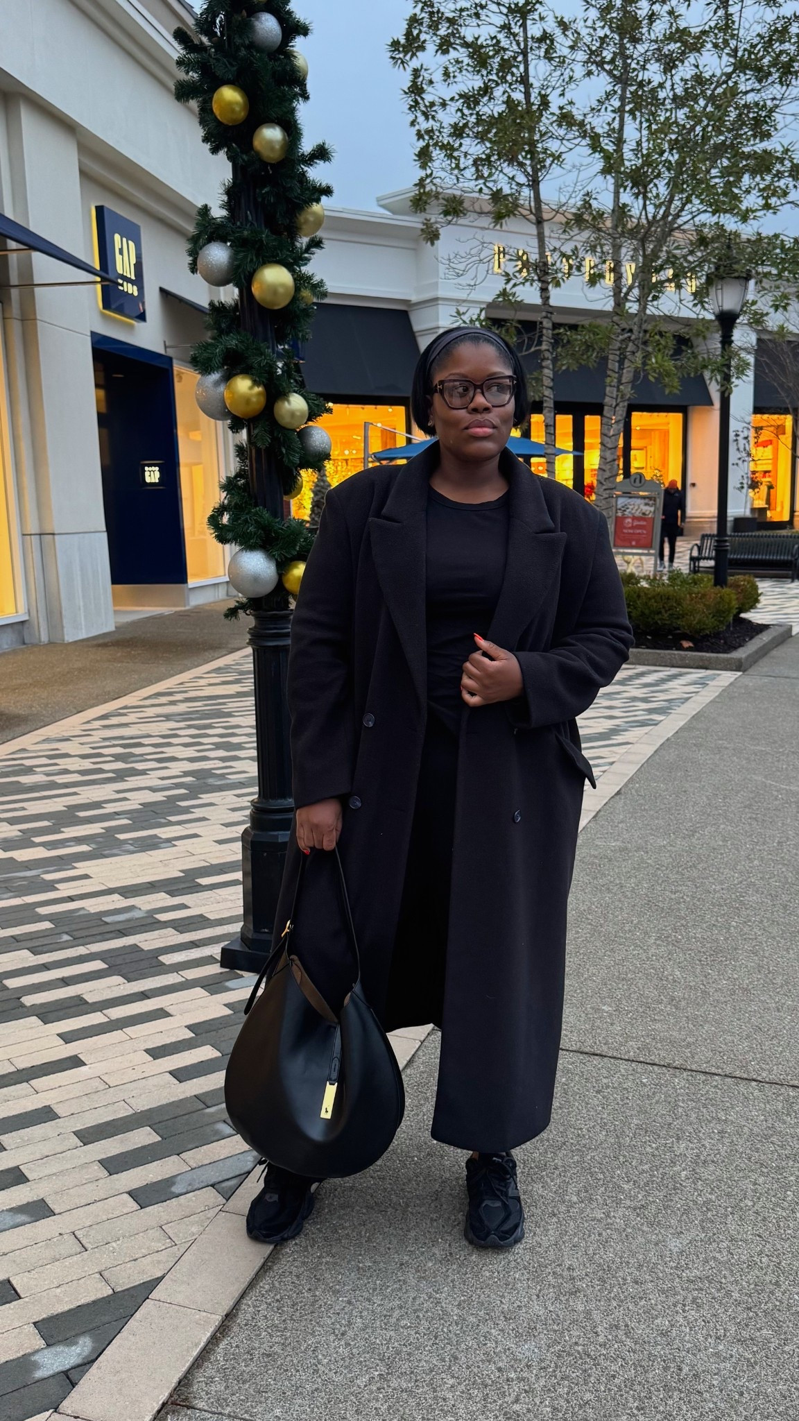 Holiday shopping in all-black everything ✨🖤
Today’s outfit was simple, sleek, and warm enough for a full day of running around. A long black coat, an easy all-black base, my go-to sneakers, and a structured bag — effortless, comfortable, and still put-together for holiday errands and mall days.

I love a monochrome look this time of year… it feels chic without trying and works for shopping, coffee runs, or casual festive outings. Linking similar pieces so you can recreate this cozy holiday shopping uniform 🖤✨

#LTKPlusSize #LTKHoliday
