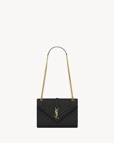 Envelope bag made with metal-free tanned leather with a front flap and magnetic snap closure, dec... | Saint Laurent Inc. (Global)