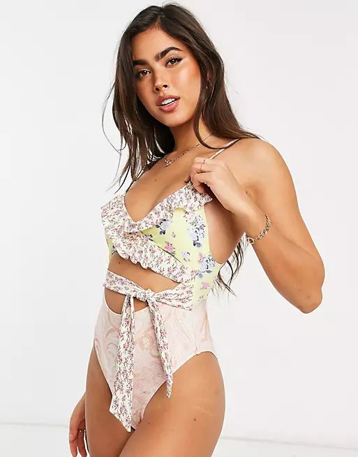 River Island floral print ruffle wrap swimsuit in pink | ASOS (Global)