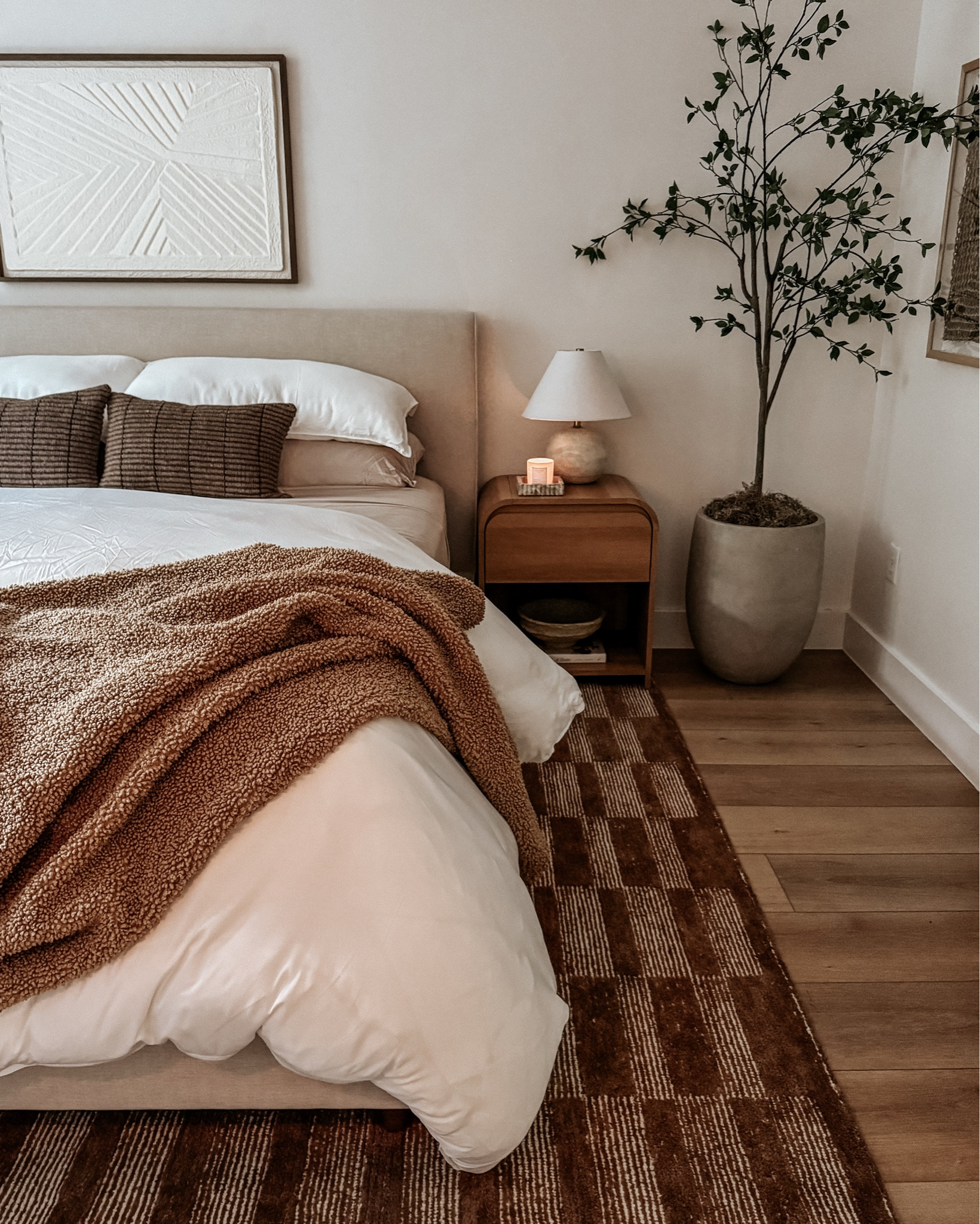 Added some warmth to my bedroom lately with this brown rug, larger brown framed art, darker throw pillows and blanket + a new planter that isn’t in these photos but will link! 

I can’t link the new rug here yet but it’s the LONE FOX X JOON LOLOI
Hancock Hand Tufted Wool Rug, available on the Joon Loloi Website. Same with throw pillows  (“Kerr throw pillows”)

Neutral bedroom, rug, rugs, bedding, home decor, neutral decor 

#LTKStyleTip #LTKHome