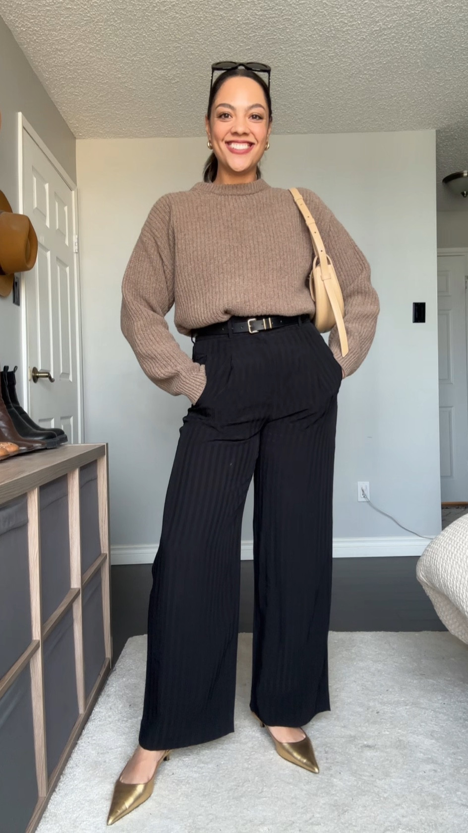 Ways to wear a crewneck sweater! Details below:

-Poppy Barley crewneck sweater in the colour dune. Made with 100% superfine lambswool. Super soft and versatile! I’m wearing a large. 
-Everlane high rise black pinstripe tailored trousers, I have a size 8. 
-Black belt with gold hardware, similar linked. 
-Gold slingback heels, similar linked  
-COS gold mini hoops. 
-Celine Triomphe 52mm sunglasses in black acetate. 

#LTKstyletip #LTKfindsunder100 #LTKSeasonal