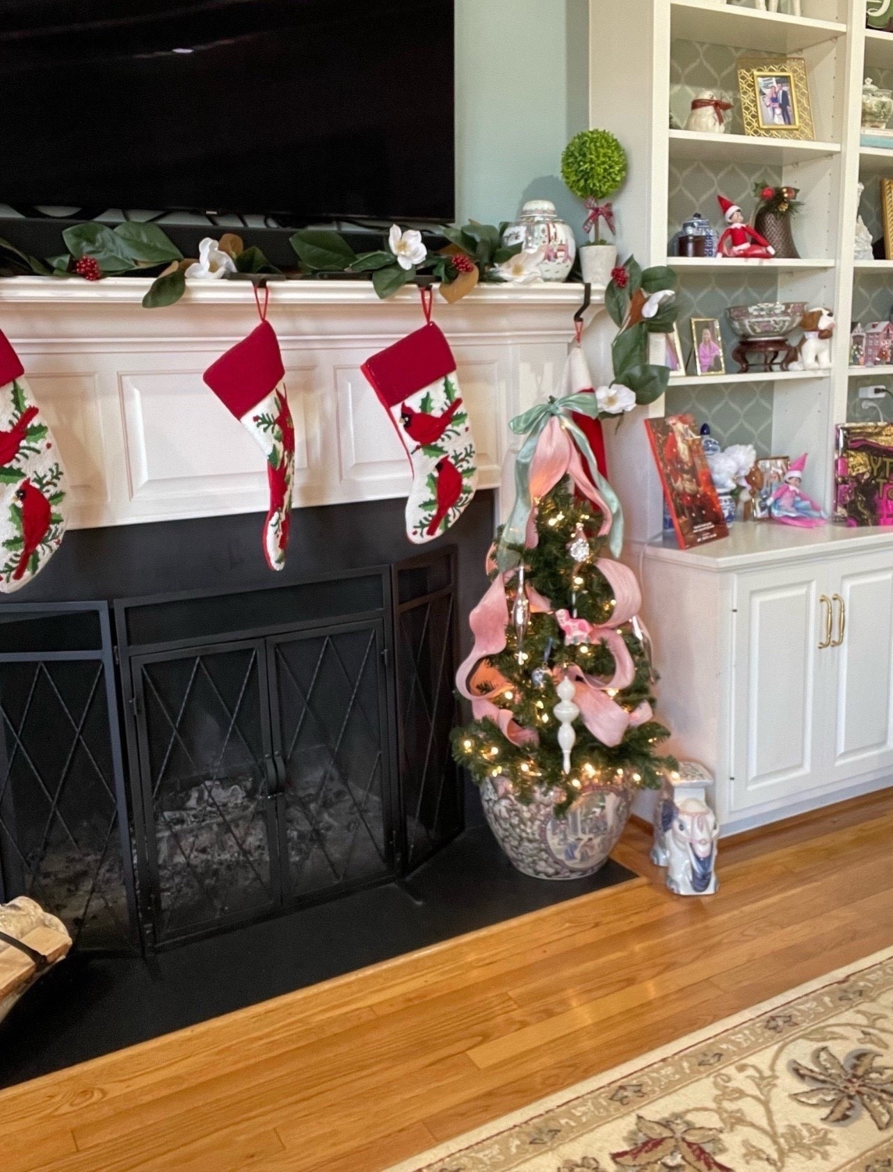 🎄 Cozy Christmas chinoiserie moment! I styled this festive fireplace with a classic mix of holiday cheer and blue & white elegance. These embroidered cardinal stockings add a traditional pop of red, while the mini tree in a chinoiserie planter brings a charming boutique touch. I dressed it with velvet ribbons in pink and green, pearl ornaments, and white finial toppers for a soft, elegant look. The garland is Magnolia & red berry with subtle sparkle and structure—simple, clean, and Southern-inspired! I love how the topiary and ginger jars still work seasonally in this cozy setup. Swipe through for similar Amazon + Michaels finds to recreate it! 🕯️🌿🎀

🎁 Linked:
	•	Mini Christmas tree + pearl ornaments 🎄
	•	Pink & green velvet wired ribbon 🎀
	•	Magnolia + berry garland 🍃
	•	Cardinal embroidered stockings ❤️
	•	Blue & white ginger jars + planter vases 💙
	•	Boxwood topiary for height + greenery 🌿

#holidaymantle #chinoiseriechristmas #blueandwhitehome #holidaydecor #ltkholidaystyle #amazonholidayfinds #michaelsstores #fireplacedecor #southernholidaystyle #cozychristmas #preppyholidaydecor

#LTKHome #LTKFindsUnder50 #LTKFindsUnder100

#LTKFindsUnder100 #LTKFindsUnder50 #LTKHome

#LTKFindsUnder50 #LTKHoliday #LTKHome