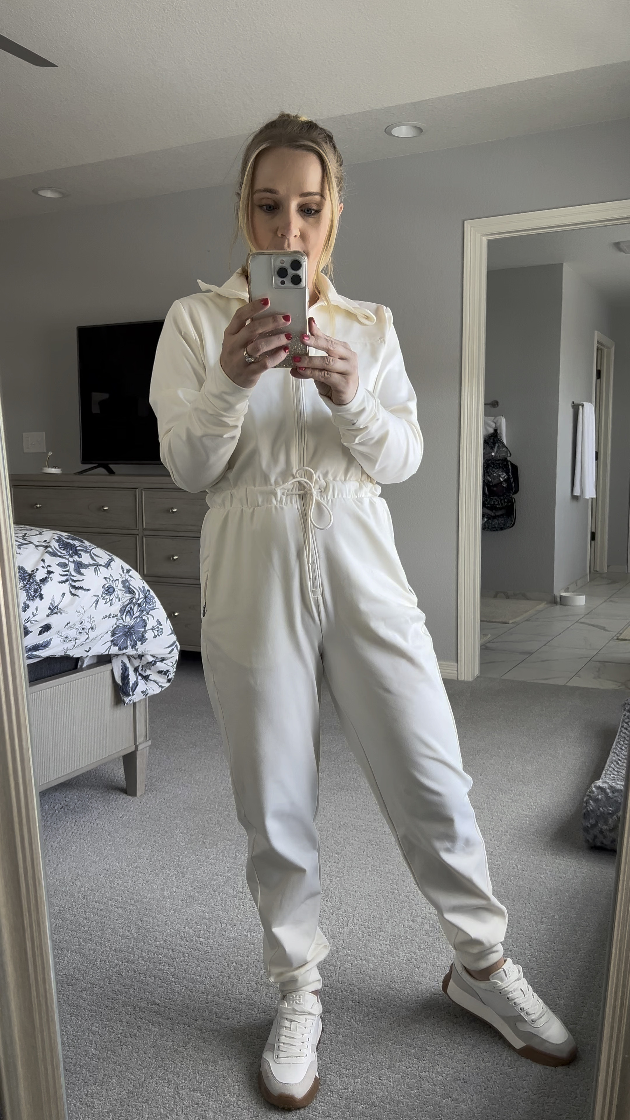 This jumpsuit is SO soft and cozy! I sized down to an xs. Jumpsuit also comes in black. Shoes fit TTS. Casual outfit. Winter outfit. Ski jumpsuit. Cozy outfit. White jumpsuit. 

#LTKSeasonal #LTKMostLoved #LTKVideo