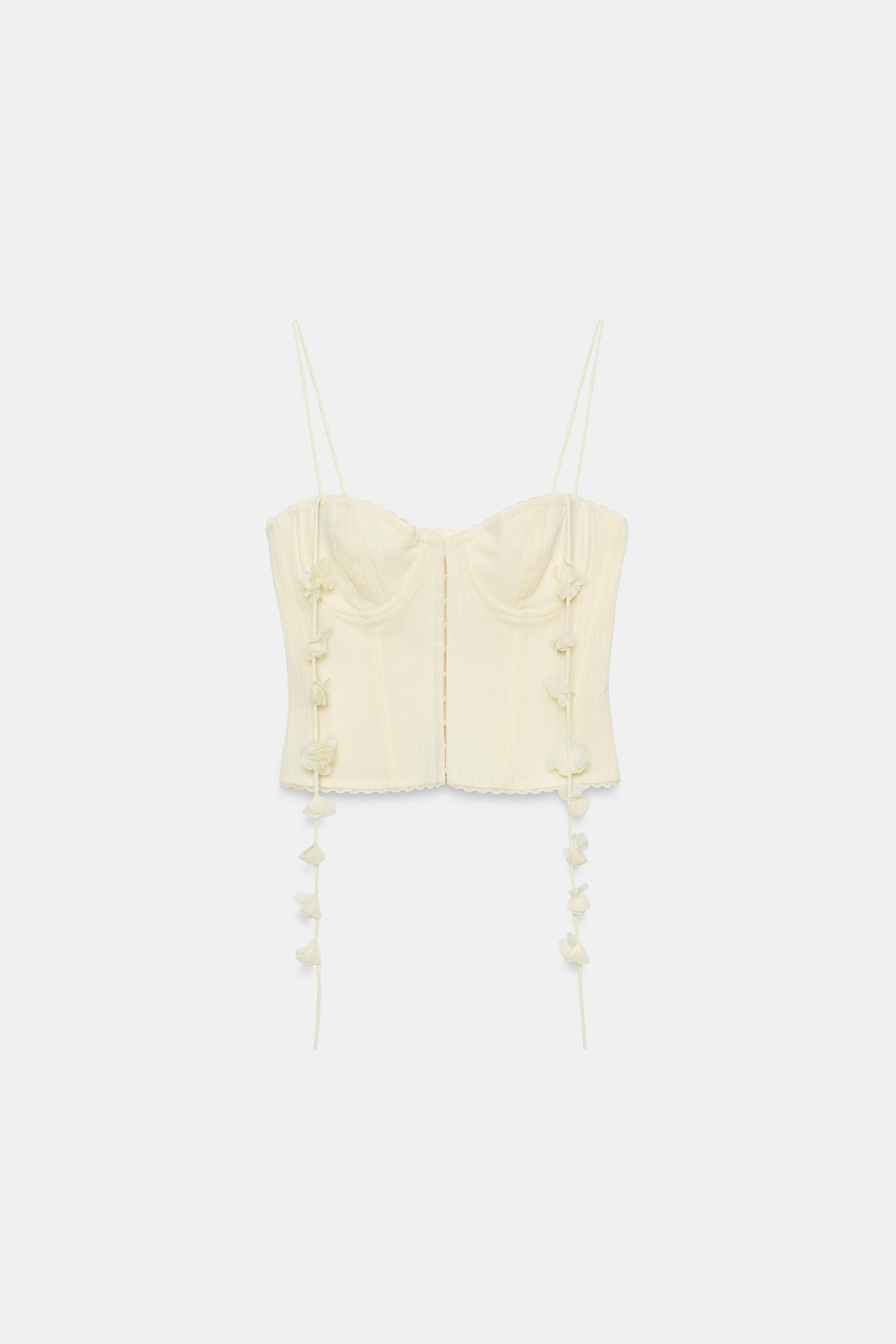 Sweetheart neckline top with spaghetti straps. Features visible seam detailing and floral appliqu... | Zara US