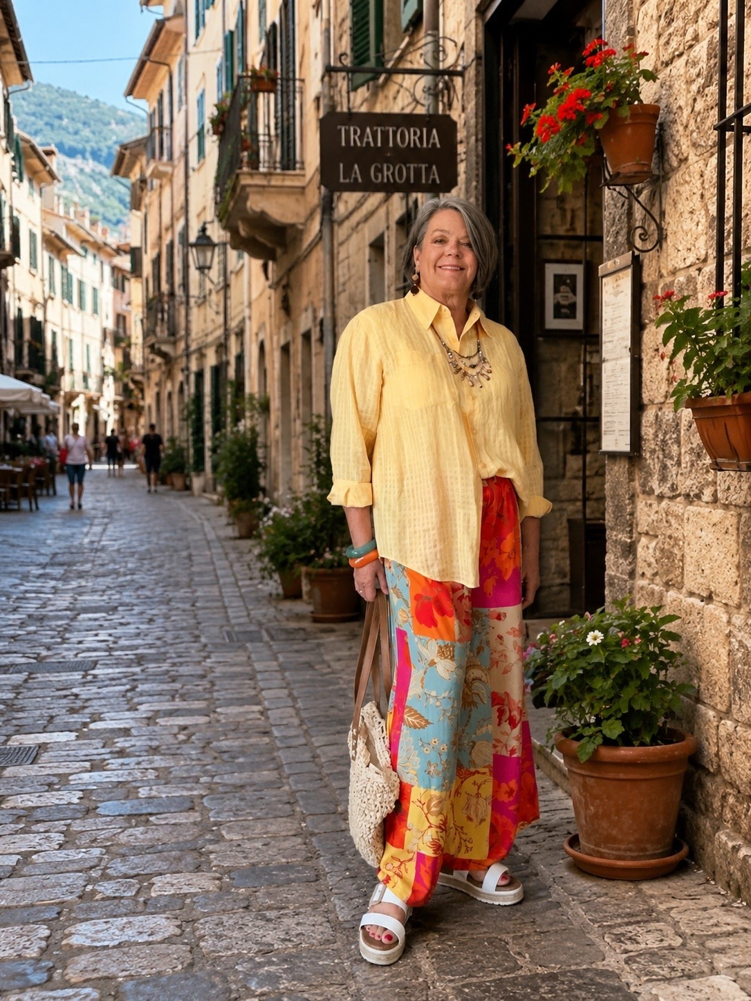 Palazzo pants! Breezy, colorful and oh so comfortable! You can’t go wrong with wide leg palazzo pants. 
A linen blouse half tucked creates a waist and a very chic look. A straw bag and fun jewelry completes the look!

#LTKOver40 #LTKMidsize #LTKTravel