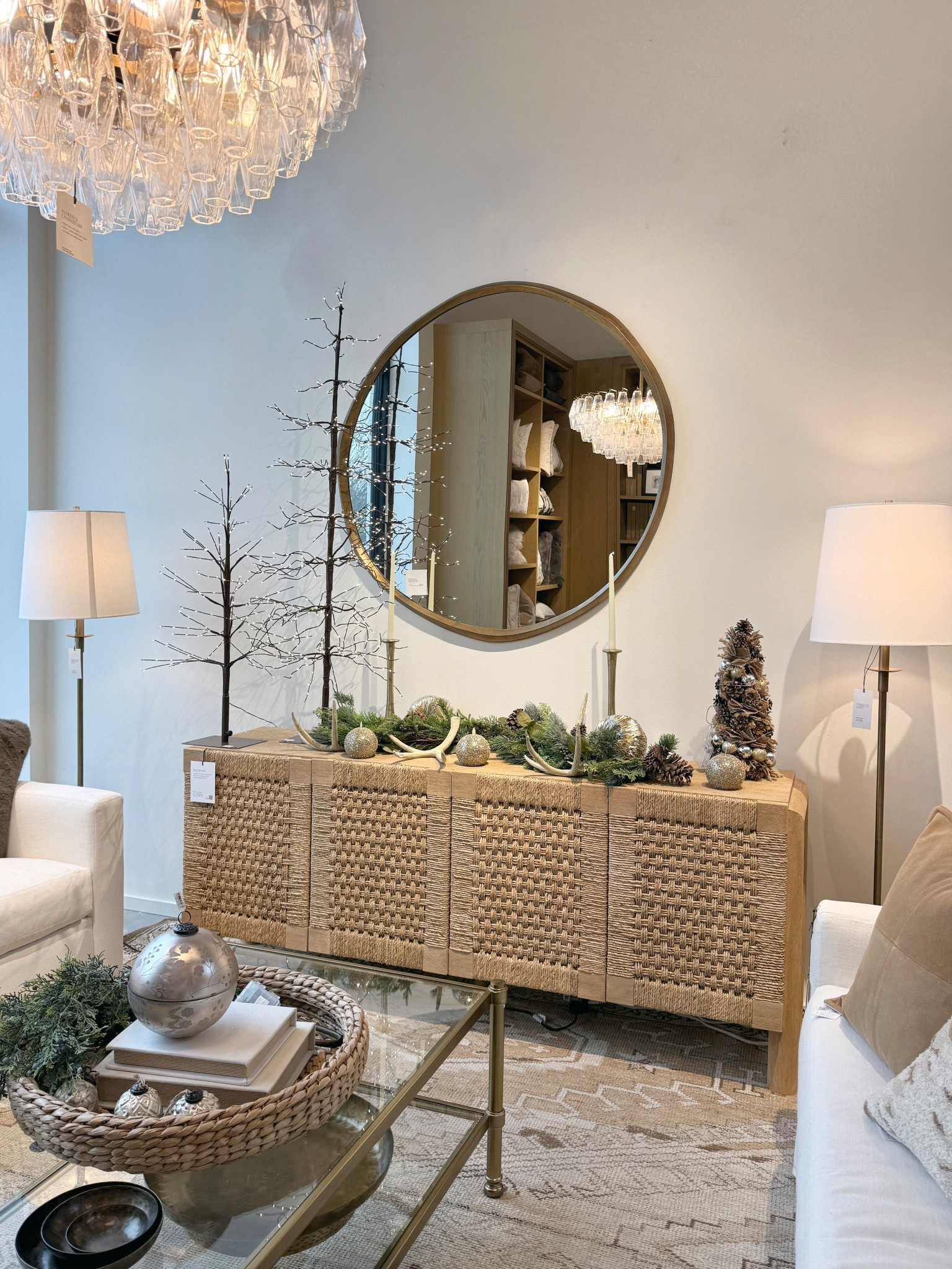 A little winter-chic moment! ✨❄️🤩 The Bolinas Woven Buffet (75”) truly steals the show here — a beautifully crafted statement piece with its textured woven front and airy, coastal-meets-modern design. Styled with gold accents, seasonal greenery, and soft holiday touches to create a warm, elegant look that feels festive without being overdone. 💫 Paired with the Sedona Oversized Round Mirror for that perfect polished finish! 🪞 #HomeDecor #PotteryBarn #HomeInspiration 

#LTKHoliday #LTKSaleAlert #LTKHome