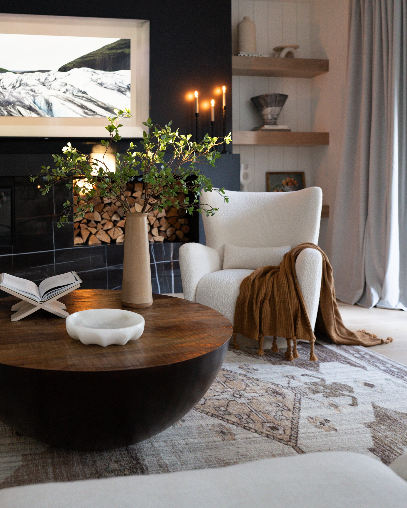 White chair 

Round coffee table, rug, faux stems, shelves, candles 

#LTKfamily #LTKhome #LTKstyletip
