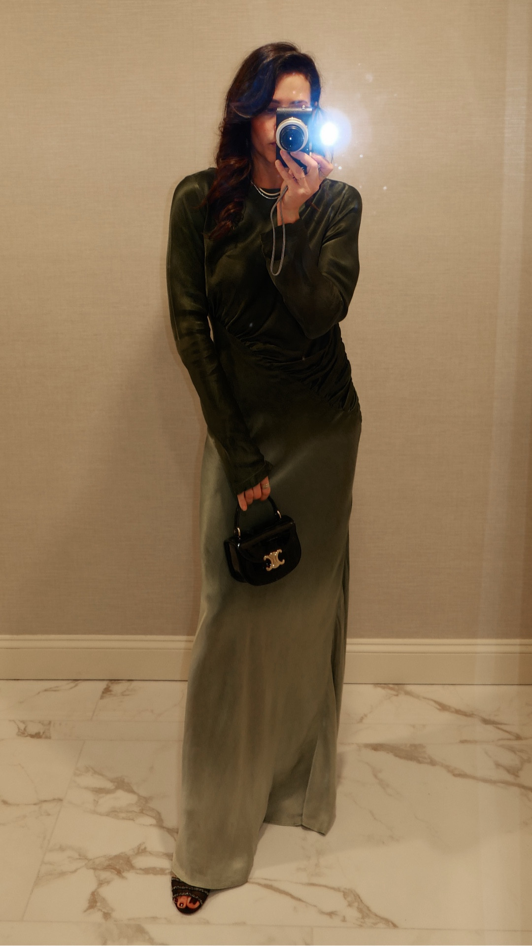 If you have a wedding, gala, or summer party coming up… stop scrolling.
This green silk dress is one of the most flattering pieces I’ve tried—snatched at the waist with the prettiest draping. A true statement without trying too hard. Found it on sale!
Dress: Small
Bag: Vivrelle 1 month free w/ code: DianaCarolina
Shoes: Old Jimmy Choo linking similar. 
Earrings: Diamonds linking similar.