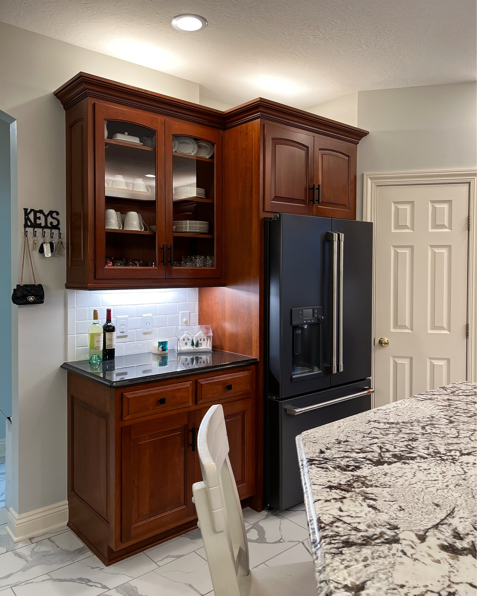 Kitchen remodel. Kitchen inspiration. Cafe appliances. Kitchen island. Granite countertops. Subway tile backsplash. Kitchen makeover. Cherry cabinets kitchen remodel. Fridge. 

#LTKhome