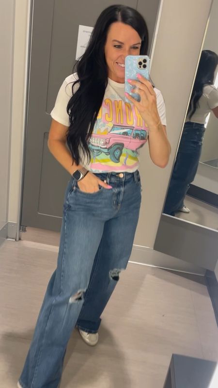 Target jeans try on! 👖 Size + fit info below. 

Size + Fit details:
Overall, I think sizing up one size in this brand of jeans is a good idea & the way to go! Great pairs of jeans under $30!
• Pair 1: wide leg distressed jeans; I have on my normal size 4, but they were tight to get over my hips with minimal stretch. I’d recommend sizing up if you’re between sizes.
• Pair 2: wide leg lighter wash jeans; fit the same as the first pair. I have on my normal size 4, but had to work to get them over my hips / minimal stretch. Size up if between sizes.
• Pair 3: floral straight leg jeans; I sized up to a 6 and they fit great!
• I’m in an XS in the graphic tee

@targetstyle #targettuesday #targetstyle #targetfashion #graphicteeshirt #springoutfits #wildfable #Itkfindsunder50 #Itkfashion #Itkseasonal #targetfinds #over30 #over30style spring outfit, spring jeans, bronco tshirt, wide leg denim, wide legs jeans

#LTKfindsunder100 #LTKstyletip #LTKVideo