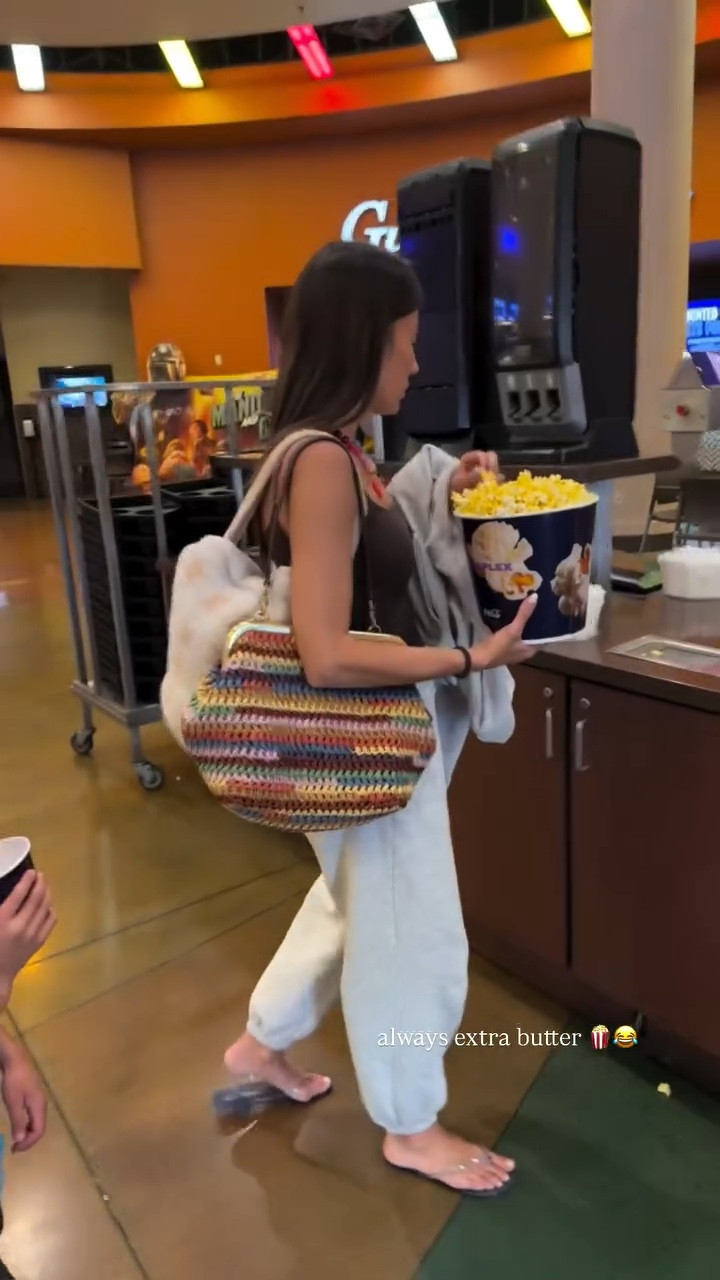 Comfy outfit for the movies 

Sweatpants & tank from @abercrombie 
Colorful bag @coach @Revolve 
Jelly sandals from @amazon
Colorful necklace from @amazon
