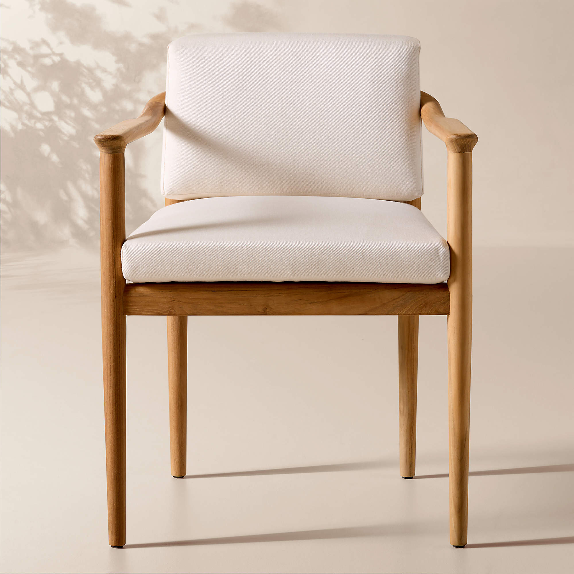 Tide Teak Outdoor Dining Armchair With Ivory Sunbrella Cushion | CB2 | CB2
