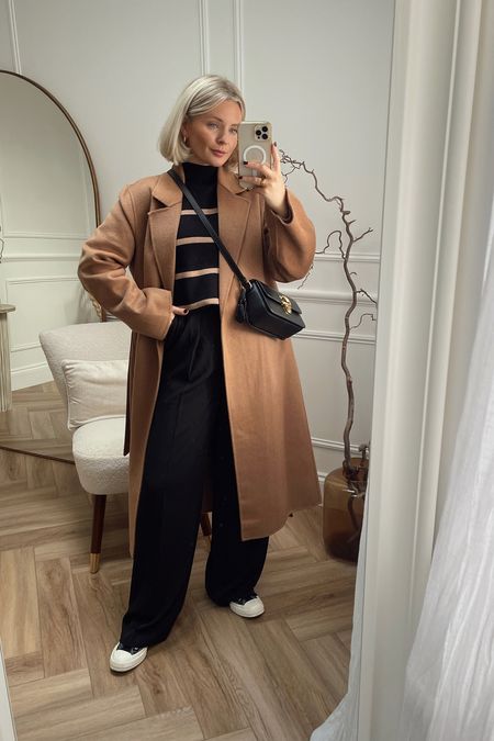 Camel & black is such a fab combination for this time of year. I’ve paired my trusty mango camel belted coat with a striped black & camel knit from phase eight, black wide leg trousers, converse & my black coach bag

#LTKitbag #LTKstyletip #LTKshoecrush