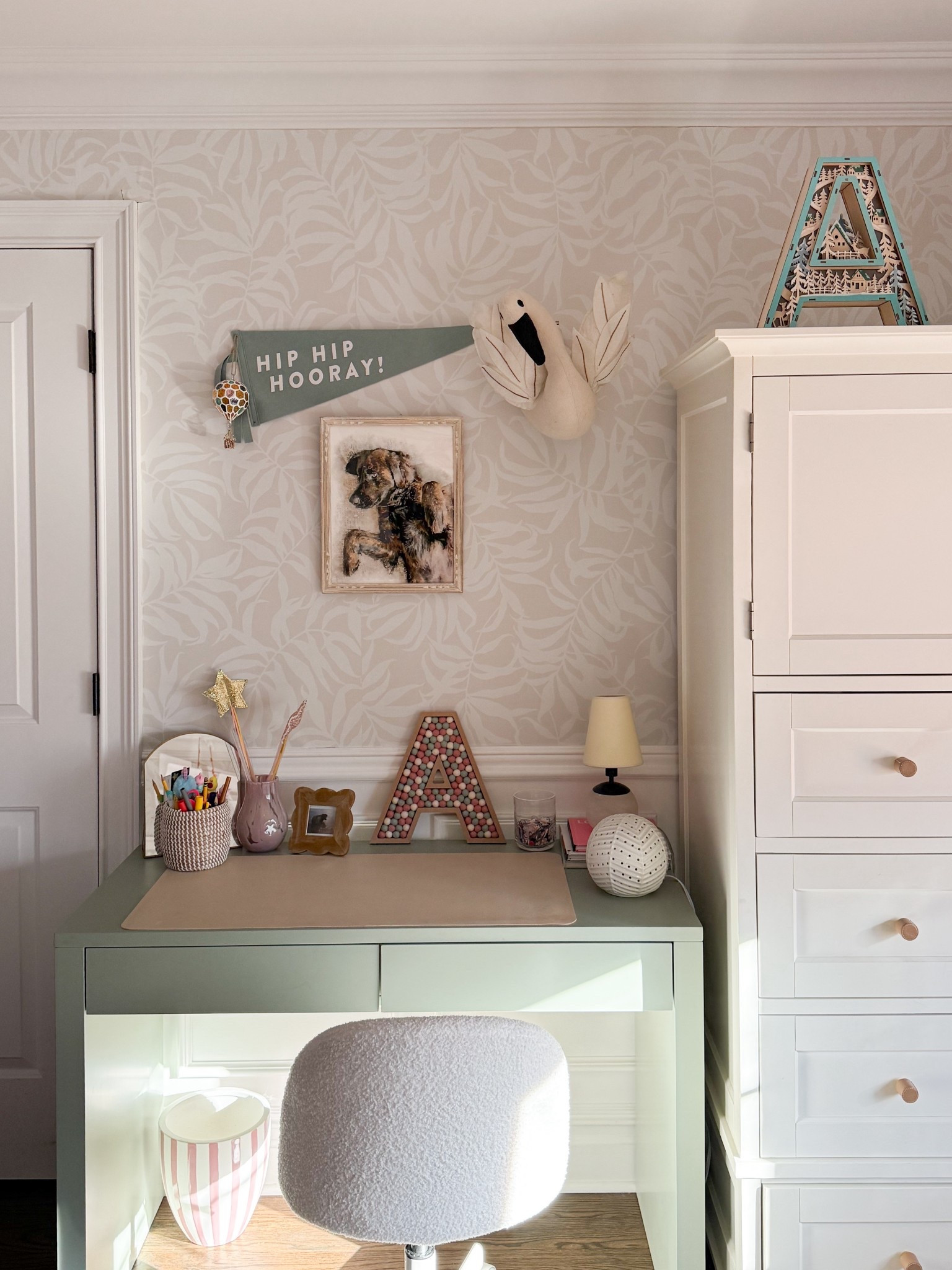 This little desk setup is one of my favorite corners, equal parts functional and fun. The soft wallpaper, sweet wall decor, and simple storage make it feel styled but still kid friendly and easy to use every day. Such a cute way to create a space they will actually want to sit down and use.

kids desk setup, kids room decor, girls bedroom ideas, kids workspace, playroom decor, wallpaper ideas, kids furniture, neutral kids room, functional kids space, girlonthehudson

#LTKHome #LTKSeasonal #LTKmomlife