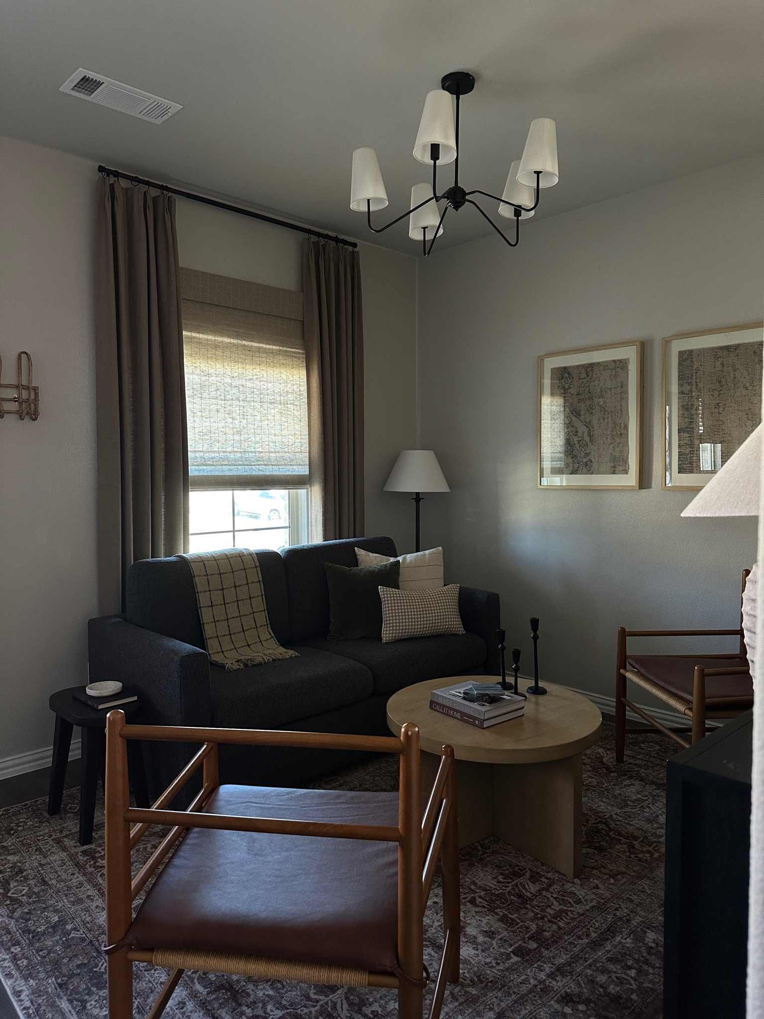 Small living spaces, livingroom decor, gray couch, gray futon, bamboo shades, Roman shades, linen drapes, linen curtains, coffee table, chandelier, lighting 

#LTKHome #LTKSeasonal