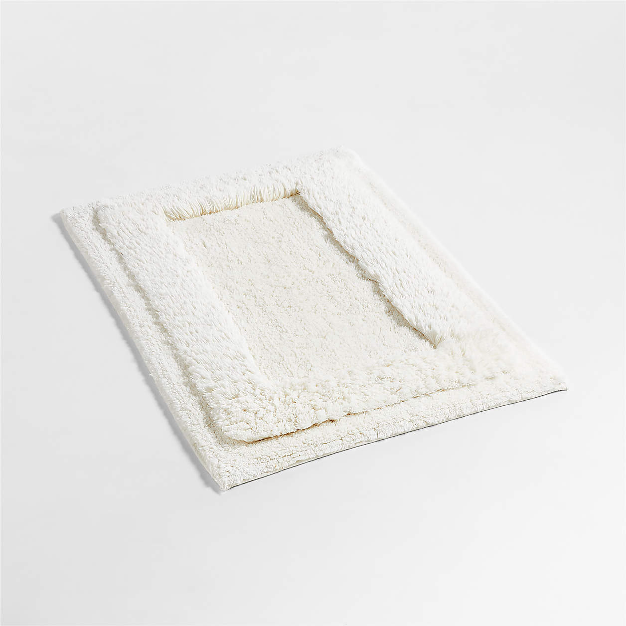 Raffee White Fluffy Cotton Bath Mat + Reviews | Crate & Barrel | Crate & Barrel