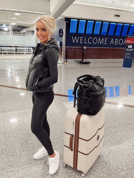AIRPORT TRAVEL OUTFIT 
BODYSUIT/LEGGINGS: S (code HollyJoAnneW for 15% off)
PUFFER VEST: XS
Nike Sneakers: TTS
DELSEY Suitcase Luggage: 28” Large
Replica By The Fireplace Perfume
Mejuri Gold Croissant Ring

- Athleisure Neutral Style, Black and White, Holiday/Thanksgiving Travel Look, Fall Winter Outfit Inspo, Chic Cold Weather Look #HollyJoAnneW

#LTKtravel #LTKstyletip #LTKCyberweek