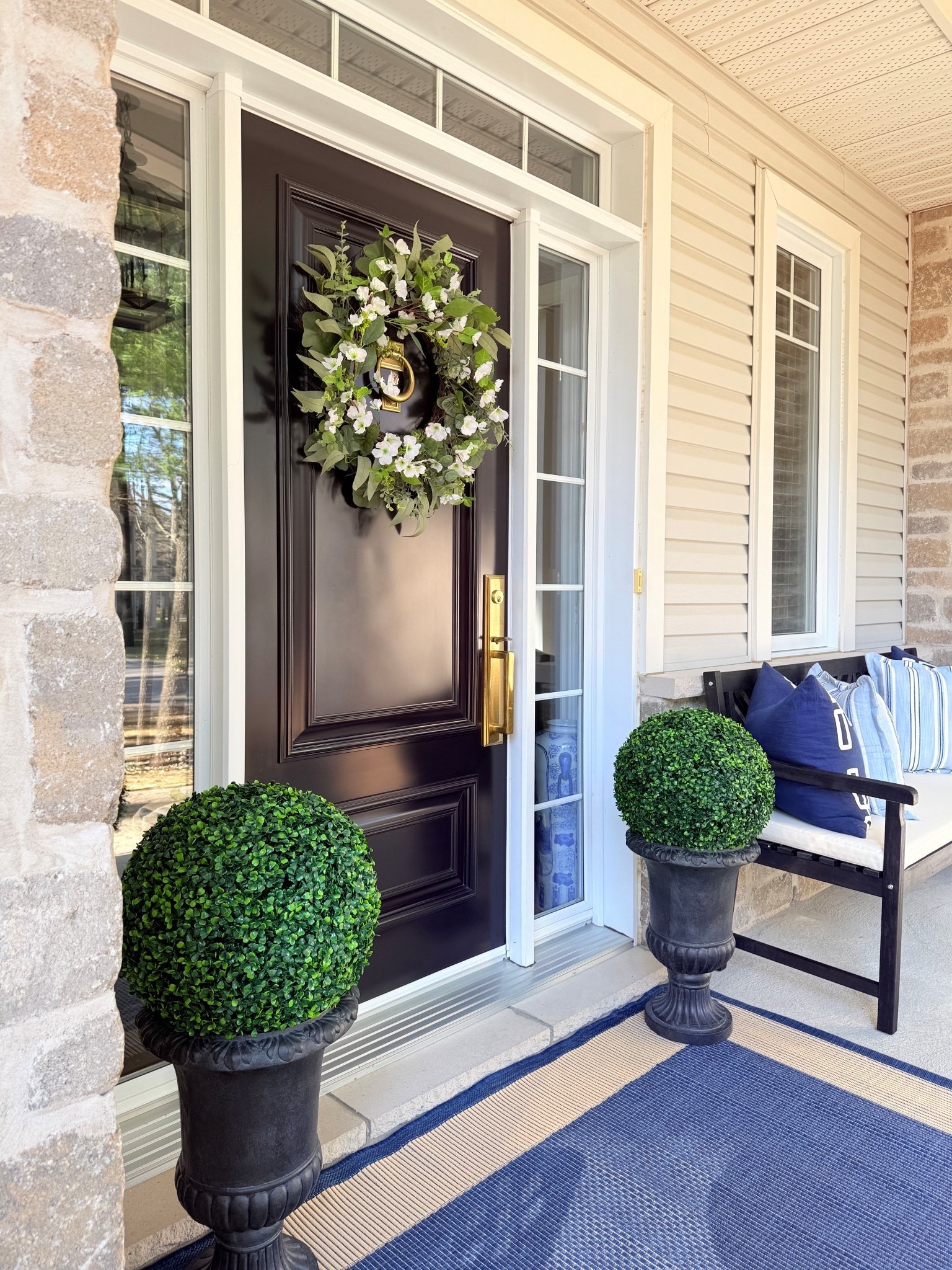 LOVING these elegant and chic urns, coastal rug and classic bench - they make a huge difference on our porch!!

#LTKSeasonal #LTKHome