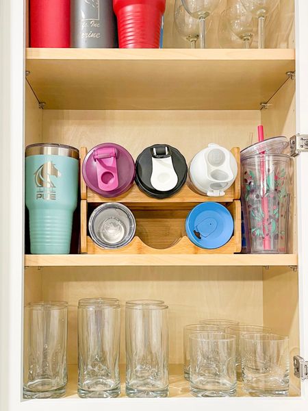 Make your water bottles look cool and organized with this @spaceaid_official bottle organizer 

#dfwdecluttered #organizedkitchen #waterbottleorganizer #kitchencupboards 

#LTKhome