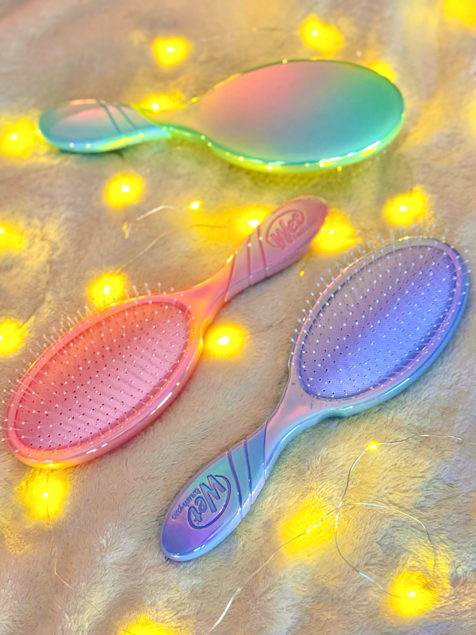 Wet Brush Limited Edition Pro Detangler from the Hello Holographic collection! The perfect affordable gift that comes in pink, blue and green 🫶🏻 

#LTKbeauty #LTKfindsunder50 #LTKGiftGuide