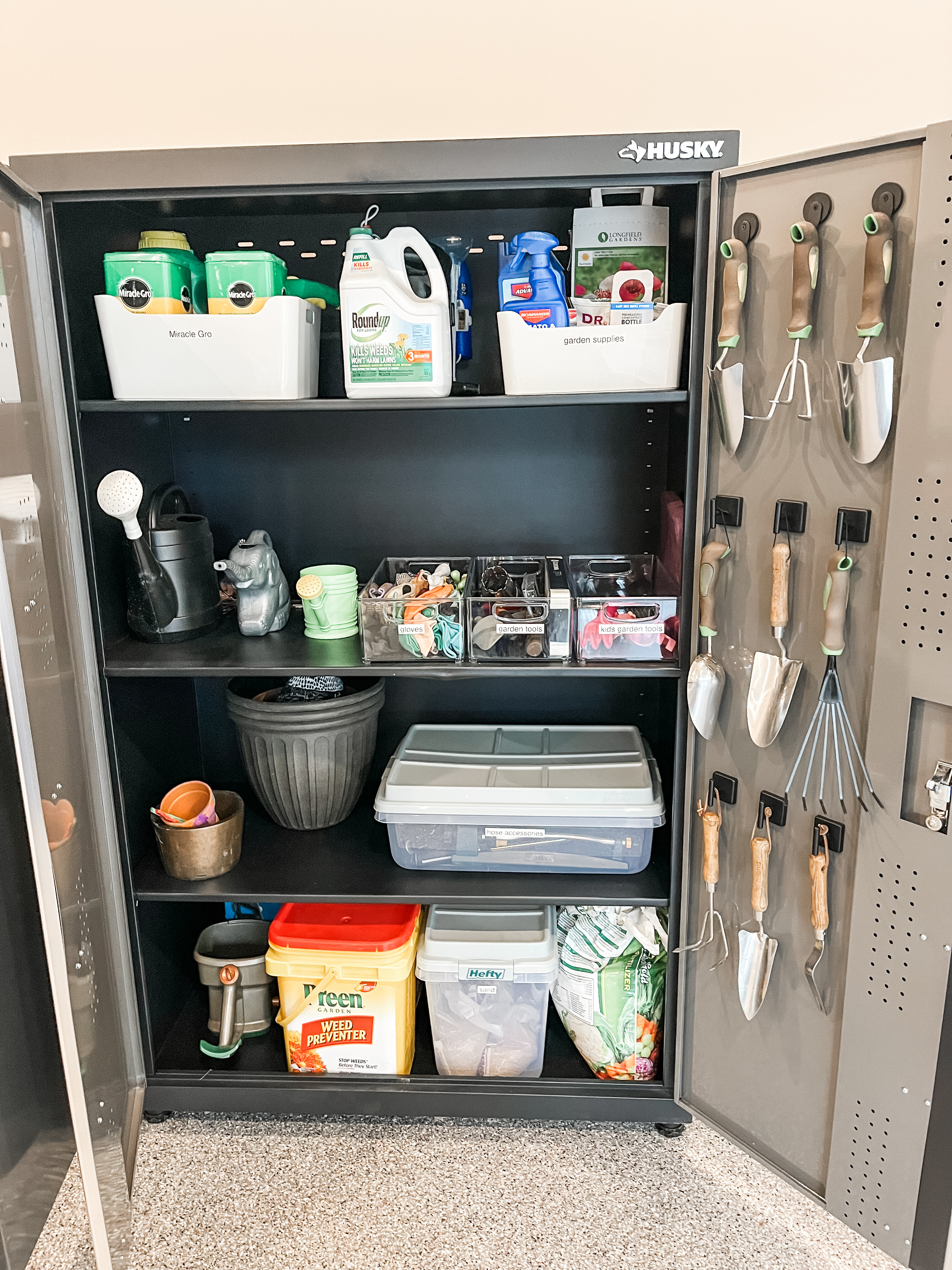 There's a lot to love about this setup, but our favorite (hands down) is the inside of the cabinet door. Props to our organizers for this genius hack making use of underutilized space for commonly used items. These small magnet hooks are perfect for gardening tools and they simply stick to the door so they can be placed exactly where you want 'em. We love creating creative solutions for you! 

 
