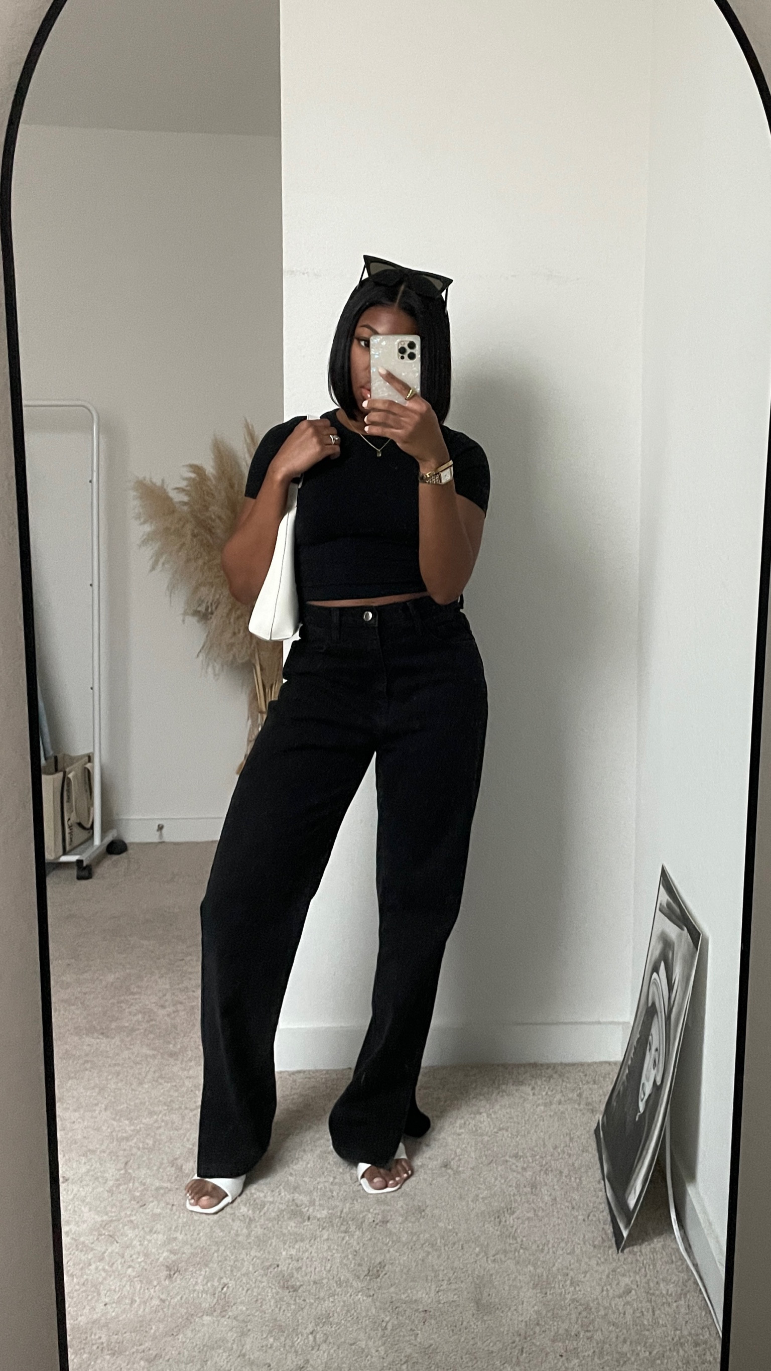all black casual Spring outfit 

black crop top, black straight leg jeans, white kitten heels, white bag, white purse, chic outfit, minimal 

#LTKstyletip #LTKSeasonal