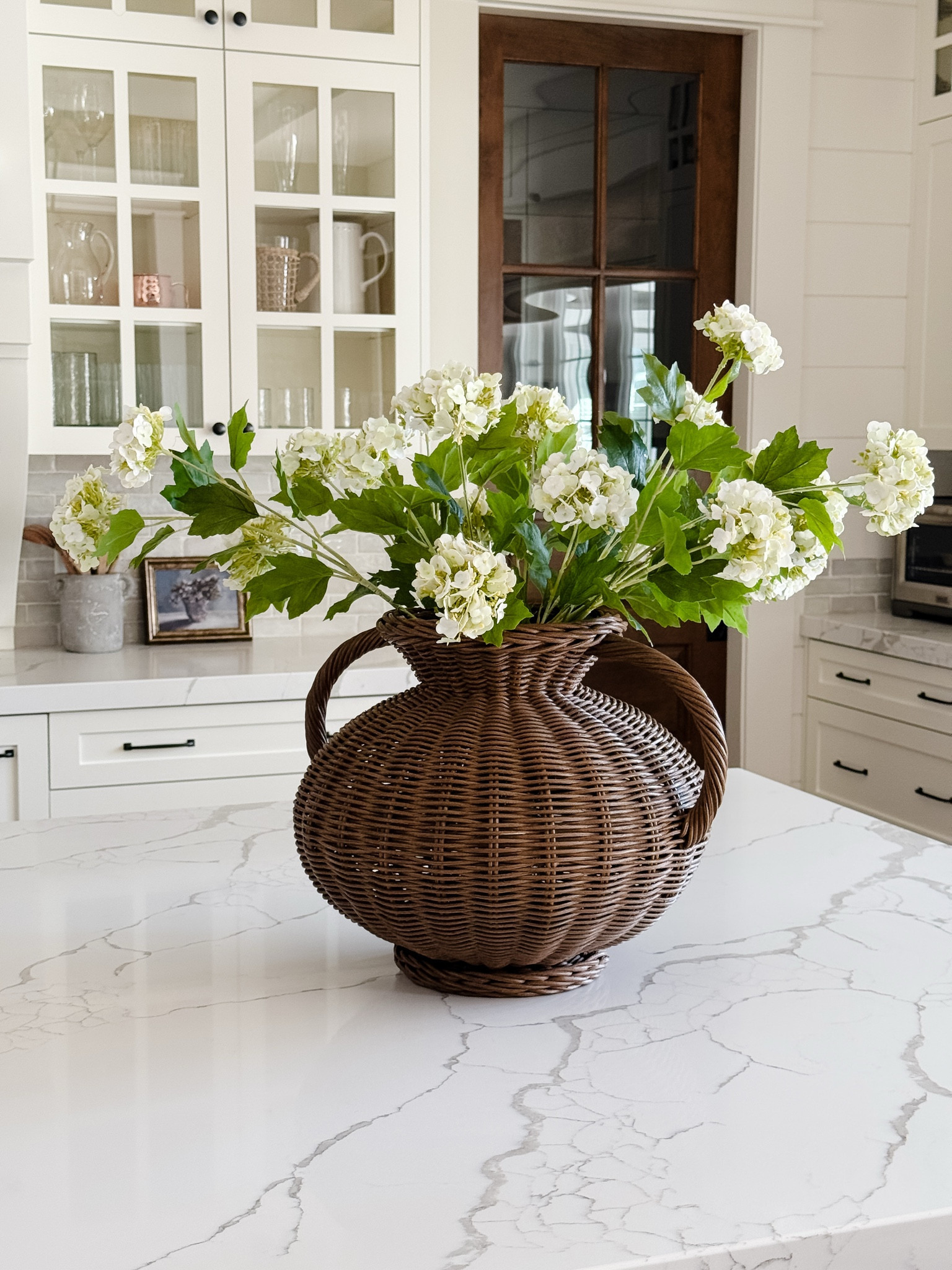 This is the perfect example of mixing high/low.  The vase was a splurge that I purchased in the fall when it was on sale and I added these beautiful snowball stems that are incredibly realistic and full, yet they are very affordable!  I recommend using 7-9 stems for a full look(pictured are 7)