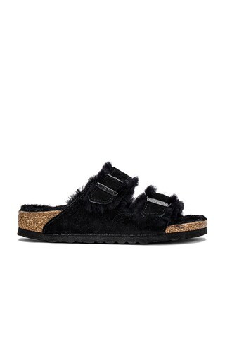 BIRKENSTOCK Arizona Shearling Sandal in Black from Revolve.com | Revolve Clothing (Global)