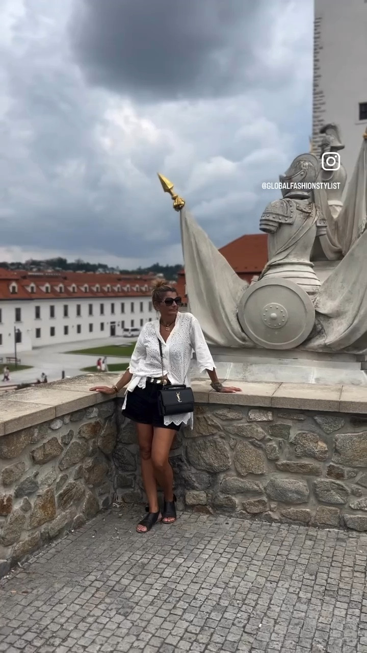 Fitcheck #bratislava #slovakia 

Elevate Your Style: Long Embroidered Eyelet Shirt with Black Shorts 💕

Showcasing a beautiful white broderie Anglaise shirt paired with classic black shorts—a perfect combo for any occasion. 

The long shirt adds a touch of sophistication and flow, beautifully balancing the simplicity of the black shorts. This combination is ideal for pear or apple-shaped women, as it draws attention to the upper body while providing a flattering shape. The delicate embroidery adds texture and interest, making this outfit truly stand out.

To elevate the look, I’ve styled the shirt tucked in on one side, revealing an interesting belt threaded through the shorts’ belt loops. This not only showcases the belt’s unique design but also creates a dynamic visual element that adds flair to the outfit. Pair this with chic black leather sandals for a polished yet comfortable finish.

And let’s not forget the accessory that ties it all together: an elegant and classy YSL handbag. This timeless piece is not only stylish but also practical, making it perfect for day-to-night transitions.

✨ Why This Look Works:

	•	The long shirt creates an elongated silhouette, perfect for balancing proportions.
	•	Tucking in one side of the shirt highlights the belt and adds an effortless touch.
	•	Black shorts provide a sleek foundation, allowing the embroidered shirt to shine.

This outfit is not just about looking good; it’s about feeling confident and empowered. Ready to revamp your wardrobe and embrace your unique style? 

Join our GlobalFashionStylist app for more fashion inspiration and tips tailored just for you! Plus, take our free body shape quiz to discover what styles work best for your shape.

👉 Follow me for more styling ideas, and let’s embark on this fashion journey together! 💖

#FashionInspiration #StyleTips #EmbroideredShirt #BlackShorts #YSLBag #BodyShape #PearShape #AppleShape #EffortlessElegance #JoinOurApp #FreeBodyShapeQuiz #WomenSupportingWomen #FashionGoals
