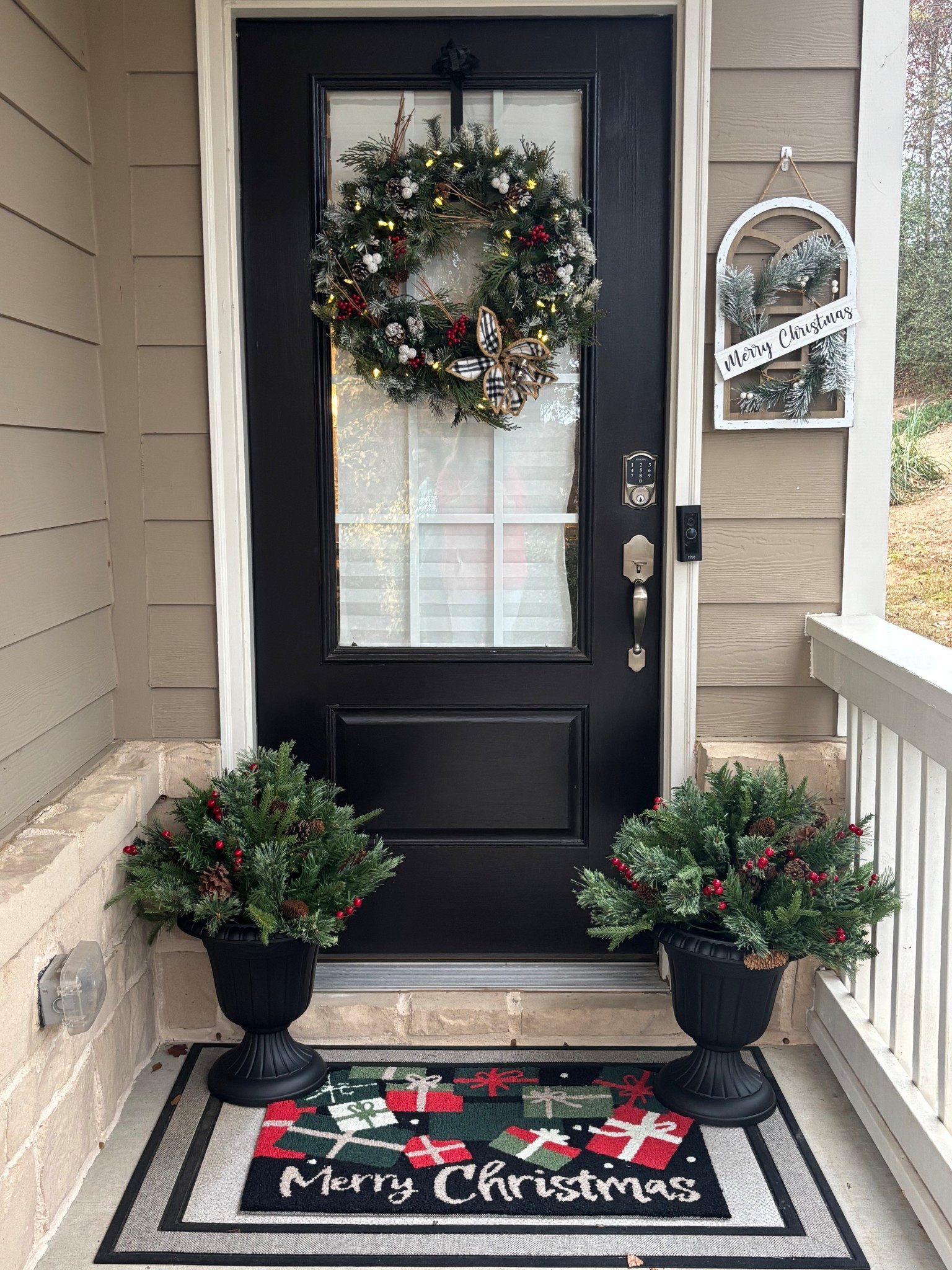 Christmas Porch Decor.

Update this year are the urns and the urn greenery from Amazon.  They light up at night too!

The door mat is from Home Goods.