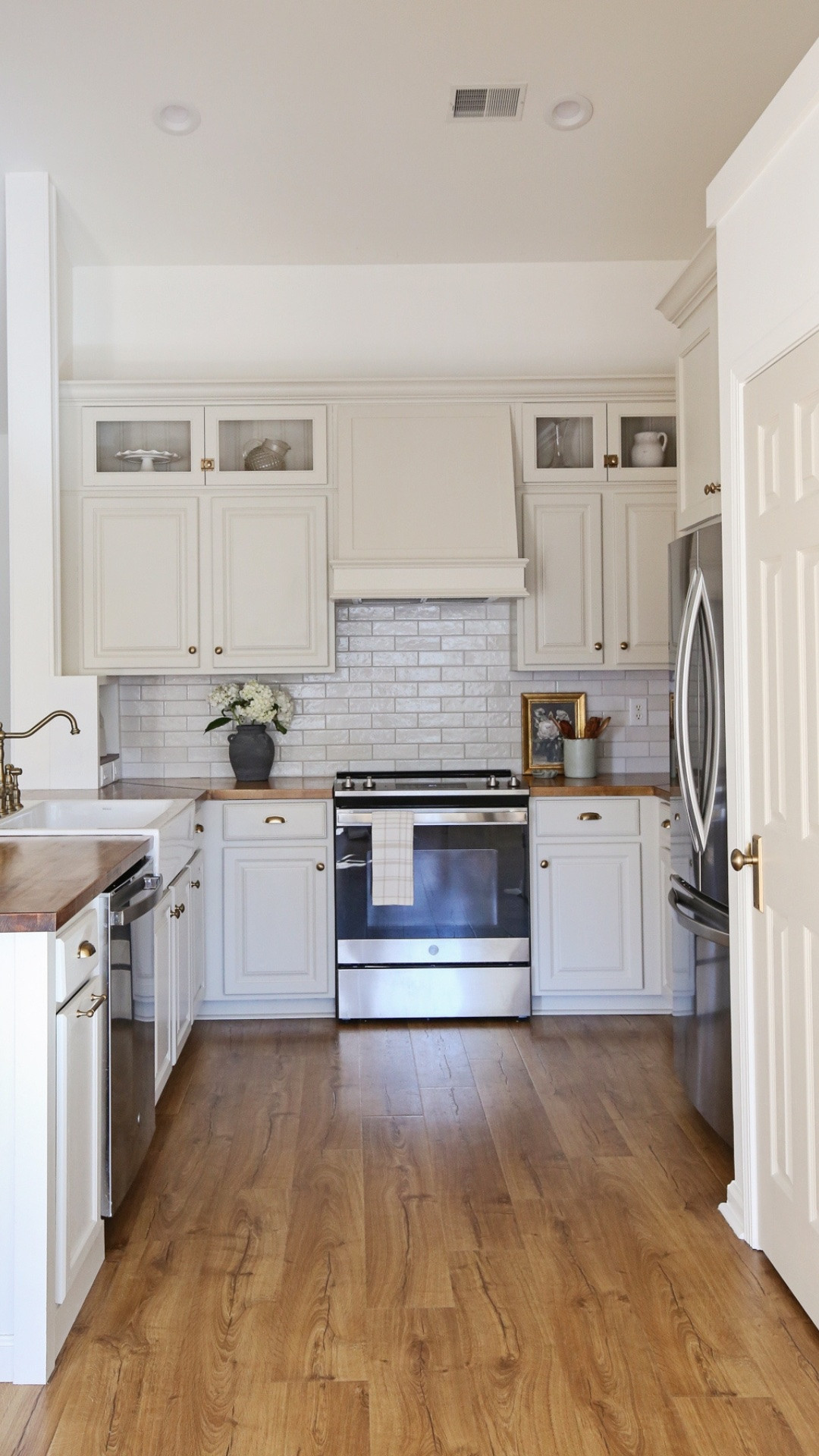 We transformed our outdated, builder grade range wall to classic and charming! The custom range hood cover is still one of my favorite features of our kitchen makeover. The handcrafted tile was the perfect backdrop for it too.

#LTKHome #LTKdayinmylife #LTKvlog