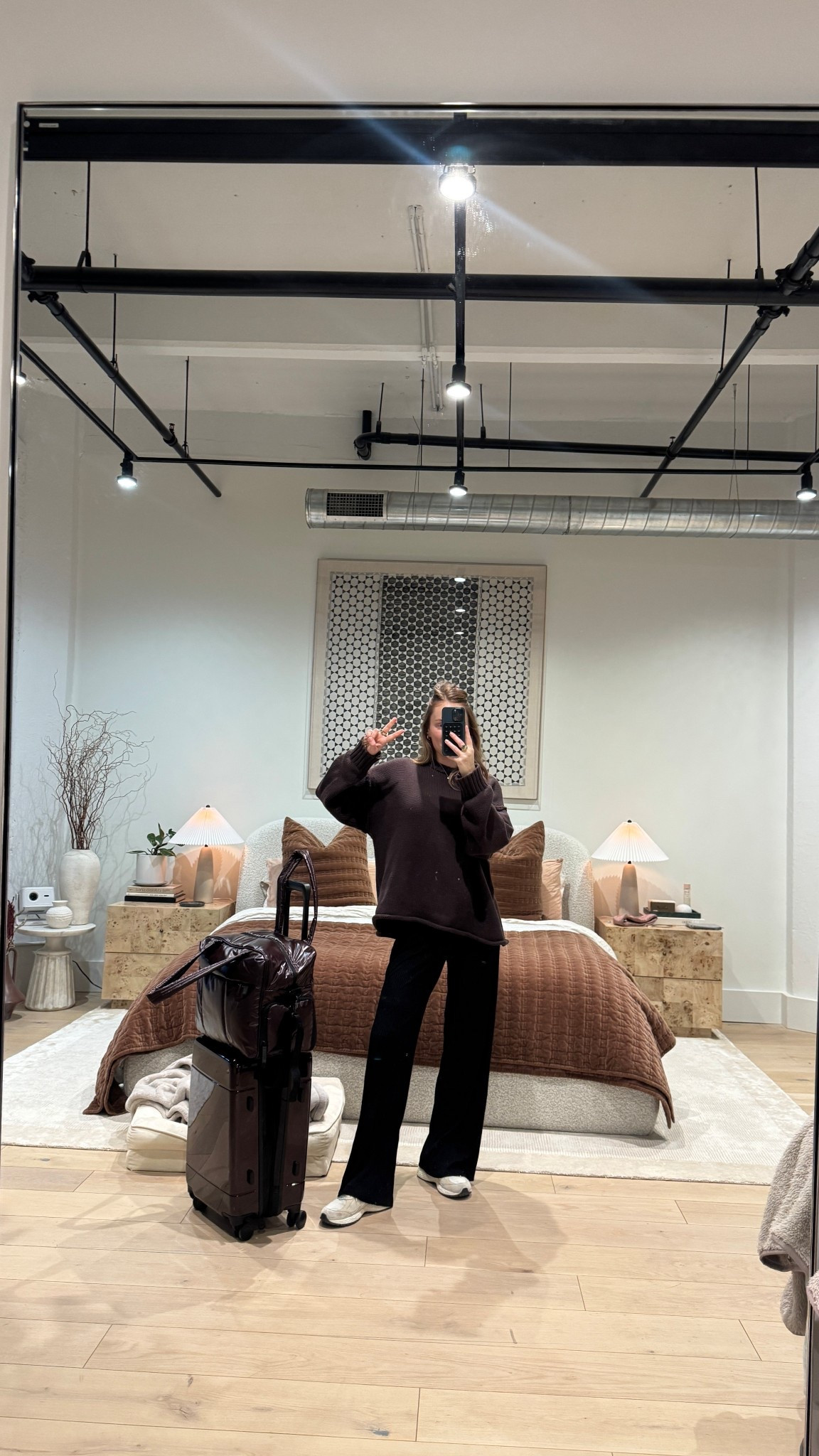 Travel day outfit! Wearing my fav comfy black pants and this oversized brown sweater. Currently on sale!