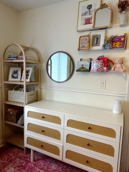 Baby girls nursery is coming together! / pink rug, arched bookshelf, gold mirror, gold frames, baby’s room, nursery, girls room, home, maternity, clear shelves, diaper caddy #nursery #girlsroom #babysroom 

#LTKsalealert #LTKhome #LTKbaby